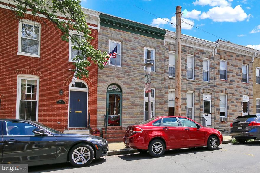 Charming & inviting home on a great street w 1200 SF of living space plus a roof deck!  Original random width pine flooring, high ceilings, recessed lighting, exposed brick & more. Central air conditioning, warm radiator heating, Good sized kitchen, separate dining room, PLUS a 1/2 bath conveniently on the main level.  Rear PARKING pad that can fit 2 compact cars (tandem). Upper level has 2 bedrooms 2 full bathrooms, washer/dryer ease of use - on bedroom level. Separate  door to roof deck (no cutting through a bedroom!) with Harbor views. Located 1 block to Riverside Park with green spaces, walking paths & tot lot. Just a short distance to  grocery stores, restaurants, gyms, public transportation. Central Location!