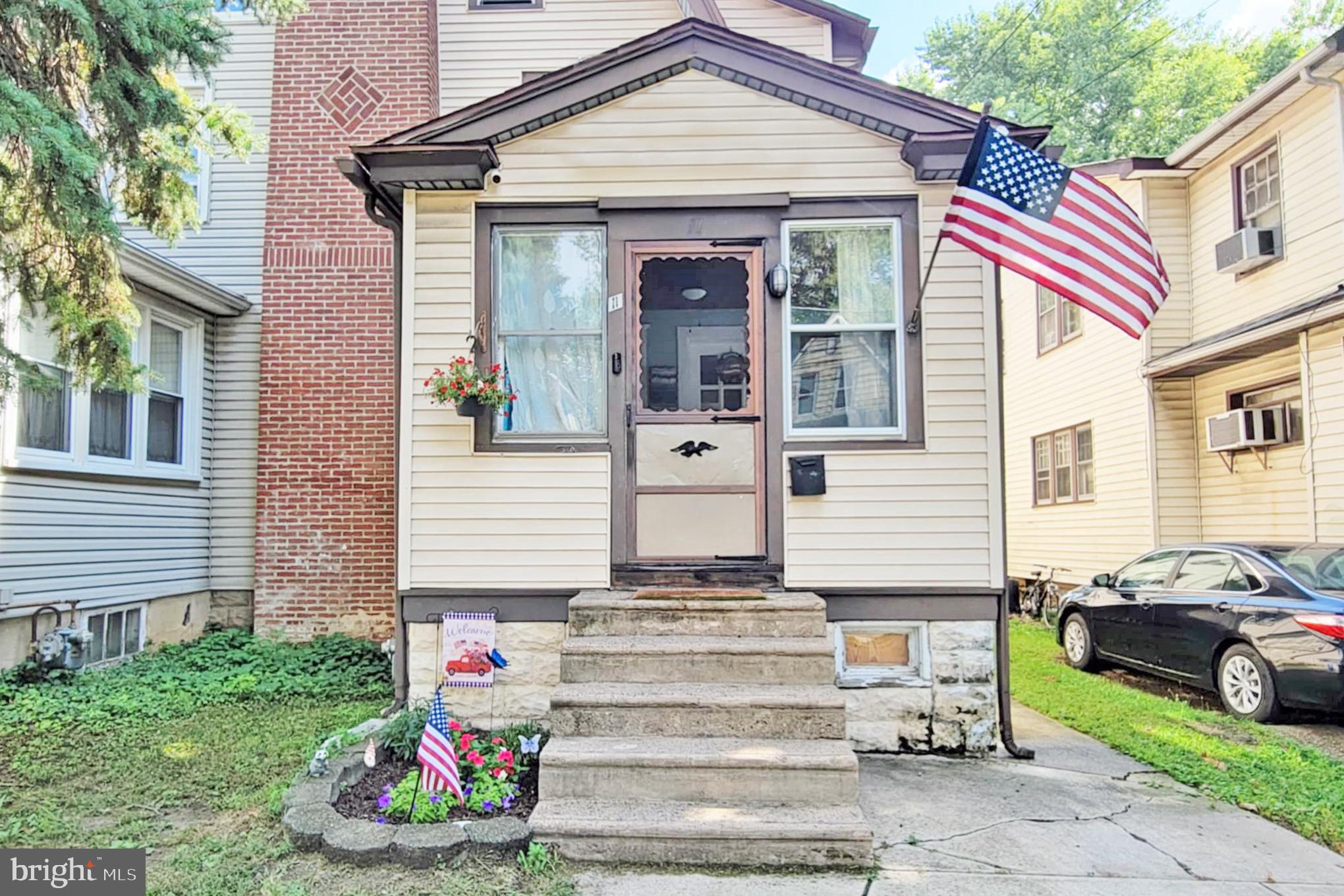 Opportunity knocks! This 3-bed, 1.5 bath twin, full of character & charm, sits right off of Chester Pike, in the Interboro School District section of Glenolden, and in walking distance to Glenolden Playground. The amount of love & care that has gone into maintaining this home over the past 24 years makes it the perfect starting point for new owners to put their own personal touches on a solid foundation. Park in the driveway, and enter in through the naturally lit, enclosed front porch, which can be used in a variety of different ways. The living room is accented by a beautiful, wood-burning fireplace & hardwood floors that flow seamlessly into the spacious dining room, where there's a wall unit that cools the entire main level. Continue on through the kitchen, which has a new dishwasher, a built-in spice rack, and additional space for another table or breakfast bar. There's also a half bath off the kitchen, as well as a mudroom with storage cabinets & a separate door to access the large yard & patio area, an ideal space for hanging out with your family & friends. The top floor has a freshly painted bathroom, refurbished doors, and generously sized bedrooms, all with ceiling fans & window units. Last but certainly not least, the basement is already framed out & ready to be transformed into a finished space. All you have to do is come take a look, make an offer, and this could be yours!
