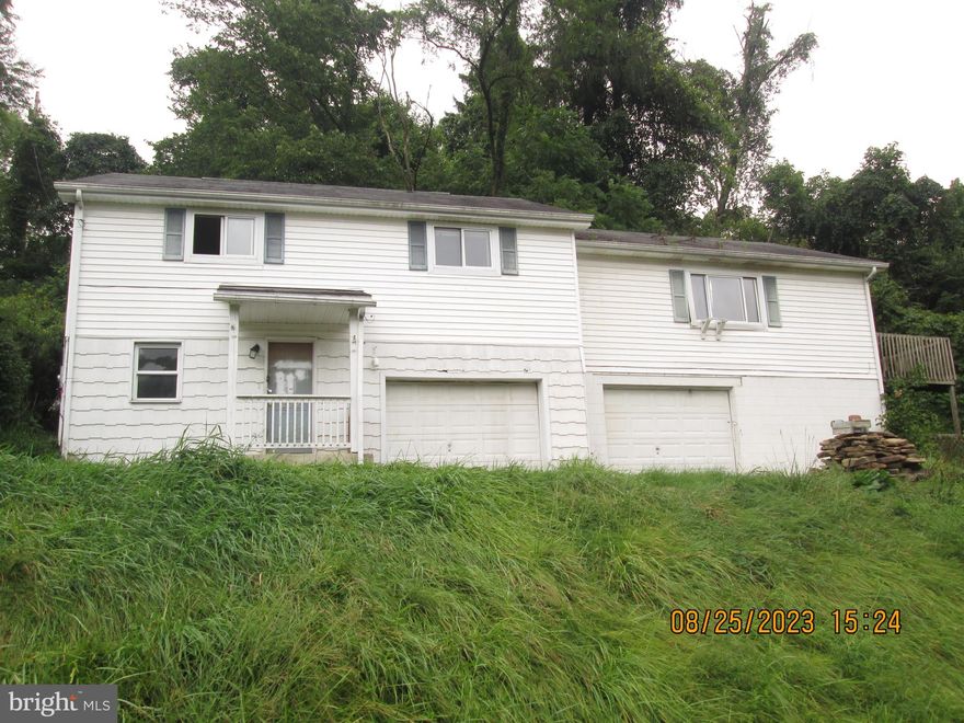Raised ranch home with tons of potential, perfect for a handyperson.  3 BRs, 1 full bath. Home offers large kitchen, living room with fireplace. Finish the basement for more living space.  Home will be sold AS IS, seller will make no repairs.