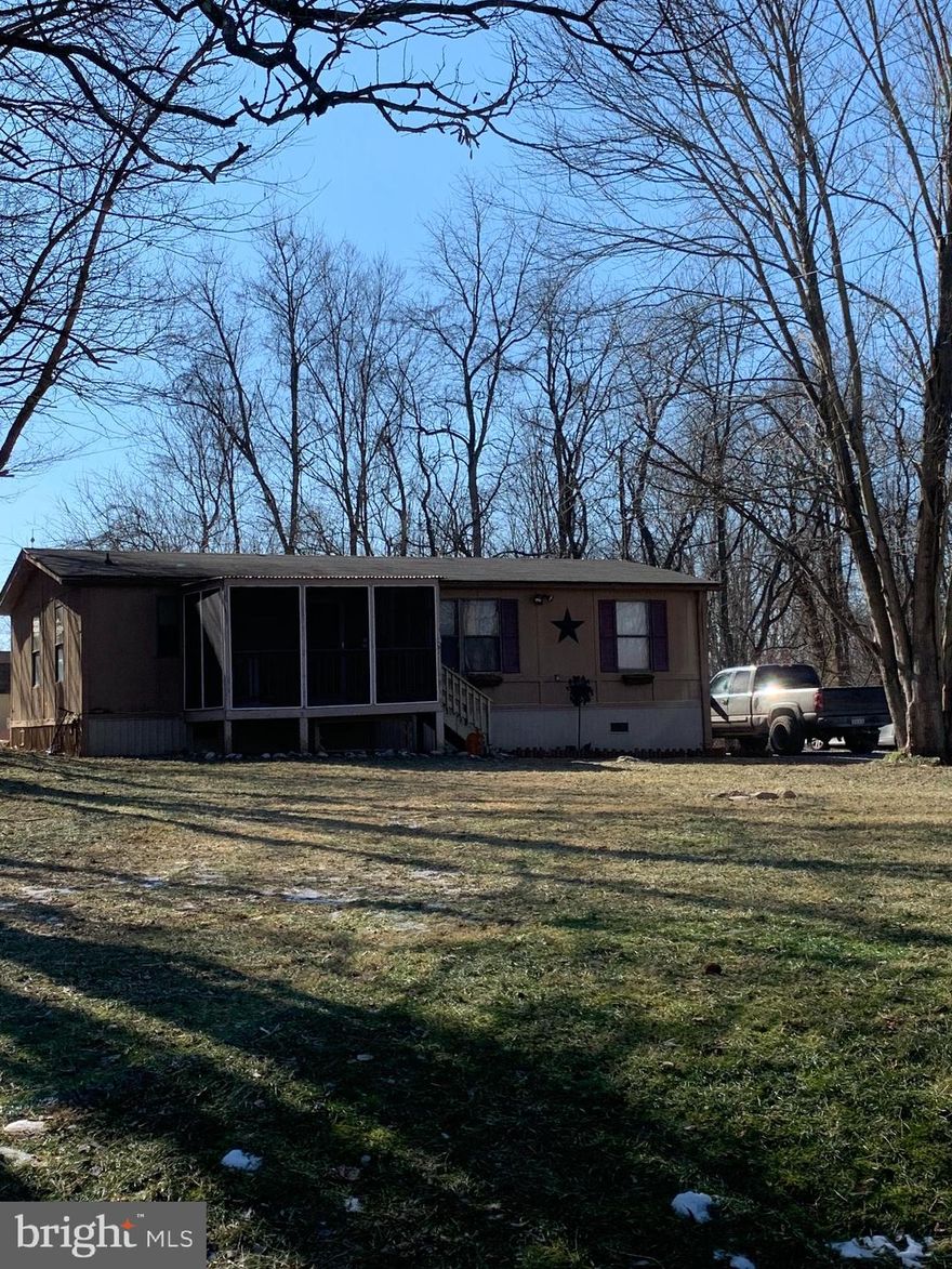 This is a great starter home that sits on 2.1 Acres in the highly sought-after Shepherdstown district.  It features 3 bedrooms, 2 baths, an eat-in kitchen, with a laundry room off of the kitchen.  Walk-in closet, garden tub in the Primary Bedroom which sits on the other end of the home for privacy.  Screened in porch, shed, and a mudroom to enter from the back yard.  This home will be sitting on a permanent foundation for financial interests.  This home will not last.  An offer came in while under coming soon,  sight unseen, and the seller accepted the offer.