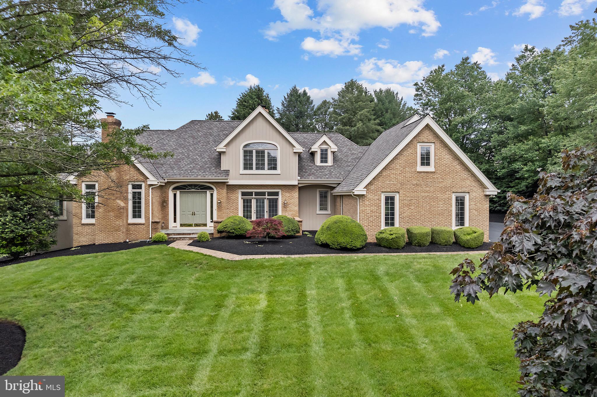 Welcome to this truly extraordinary 4-bedroom, 3.5-bath home nestled in the prestigious Merestone community of Landenberg. Thoughtfully designed and impeccably maintained, this residence offers the perfect blend of classic elegance, modern upgrades, and everyday comfort—all surrounded by a beautifully landscaped, private yard.
Step inside to a grand two-story foyer with a custom turned staircase, flanked by a formal living room with a cozy fireplace and an elegant dining room featuring French doors that open to a charming front patio. Hardwood floors flow seamlessly through much of the main level, creating warmth and cohesion throughout the home.
The heart of the home is the spectacular two-story family room, complete with a stunning stone fireplace, sitting area with built-ins, and French doors leading to the rear deck. This inviting space opens directly to the gourmet kitchen, where you’ll find granite countertops, ample cabinetry, a large center island, peninsula with seating, tile backsplash, stainless steel appliances, double wall ovens, plus a handy desk area. Just off the kitchen, the sunlit breakfast room leads to a 3-season sunroom and the outdoor oasis beyond—perfect for relaxing or entertaining in style.
The main-level owner’s suite is a true retreat, offering expansive space, walk-in closet, and a private bath with double vanity, oversized soaking tub and stall shower.
Upstairs, you’ll find three additional bedrooms, including one with an en-suite bath and two that share a spacious hall bath. Two huge unfinished rooms on the upper level provide versatile options for storage or future finished spaces which could include a home office, hobby rooms, exercise rooms—the possibilities are endless.
Downstairs, a 3-car garage and meticulous upgrades throughout the home complete the picture. Enjoy peace of mind with a new architectural roof (2025), 10’ ceilings, high-end built-ins, and countless custom touches throughout. The location can’t be beat—close to shops, restaurants, parks, schools, athletic centers, and major commuting routes.
This is not just a home—it’s a statement. Every inch has been thoughtfully updated, beautifully maintained, and designed to impress.