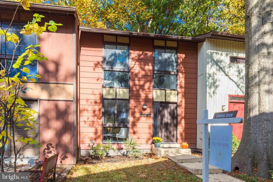 Nestled in a quiet cluster, this completely remodeled townhome is complete with 3 bedrooms, 2 full baths and charming outdoor space. A contemporary exterior, on trend paint, renovated kitchen, updated baths, and an abundance of new windows create instant appeal. An open foyer welcomes you into the living room where twin windows flood the space with sunlight illuminating chic gray floors. The dining room with space for all occasions is accented by a modern chandelier and a sliding glass door granting access to the spacious patio and private yard with scenic views. Back inside, the contemporary kitchen is sure to please with stunning quartz countertops, pristine white cabinetry, and stainless steel appliances including a smooth cooktop range and oversized refrigerator. A spacious island doubles as a breakfast bar, as the open atmosphere facilitates entertaining during meal preparation. Ascend the staircase to the light-filled owner's suite boasting new flooring, two large closets, and a trendy light fixture. Down the hall, an additional bright and cheerful bedroom with generous closet space, share a well-appointed full bath. The full bath features barn door entry, dual vanities, seamless glass enclosed shower, and the coolest tile combination. The lower level recreation room doubles as a full bedroom and offers another gorgeous bathroom with decorative tile straight out of a magazine. Upgrades include new roof (2020), new HVAC (2020), new hot water heater (2020), new windows (2020), new floors (2020), new kitchen (2020), 2 new bathrooms (2020), new appliances (2020), new patio (2020), new paint (2020), new sliding door (2020), new 2 panel interior doors (2020), new light fixtures (2020) Fenced Rear 2022.  Short drive to Reston Town Center and the metro. Reston amenities include pools, tennis courts, and more.