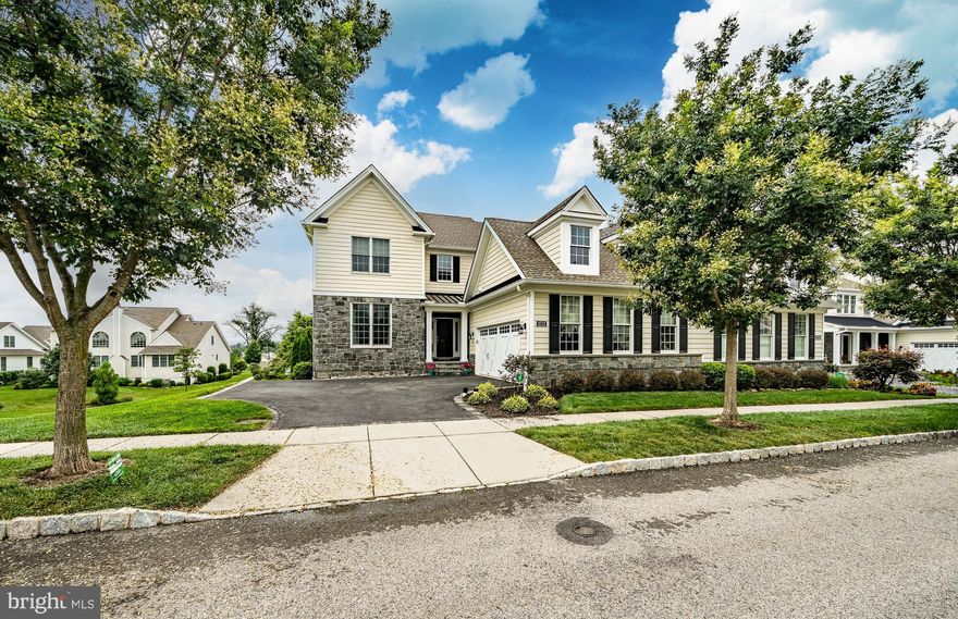 Welcome to 3737 Rosemont Pass, a stunning 4-bedroom, 3.5-bath carriage home in the prestigious Liseter community of Newtown Square. This beautifully upgraded Rosemont model features a dramatic two-story foyer with sweeping curved staircase flanked by a formal living room and dining room, setting the tone for elegance throughout. The gourmet kitchen is a chef’s dream with a large center island, adjacent breakfast area, and views into the expansive family room featuring a soaring two-story ceiling and exquisite custom millwork. The main-level primary suite is a serene retreat, complete with a spacious walk-in closet and a luxurious en-suite bath offering a dual sink vanity with dressing area, private toilet room, and oversized shower with built-in seating. Upstairs, you'll find three generously sized bedrooms—each with its own walk-in closet—and two additional full baths for ultimate convenience. The fully finished lower level provides expansive open space for entertaining, fitness, or recreation. Enjoy outdoor living on the oversized composite deck, perfect for relaxing or entertaining, and a beautifully landscaped yard. This exceptional home combines classic design with modern luxury in one of Newtown Square’s most sought-after communities.