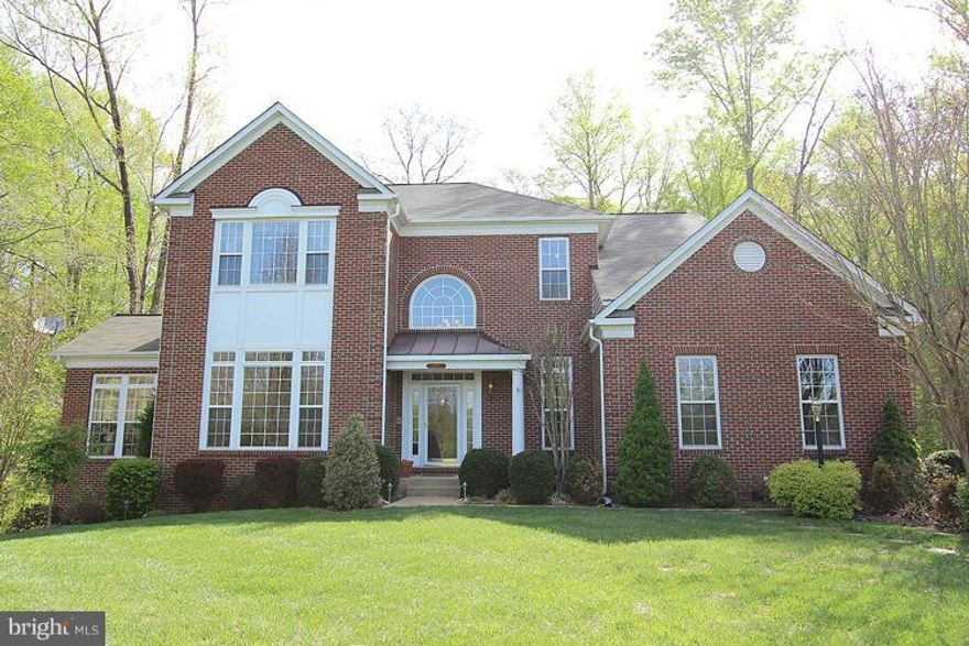 Charming estate style home w/ tons of upgrades & features main lvl gourmet kit w/corian counters & 42" cabinets,3 zone heating, 14x16 conservatory,frml liv rm,frml dr,main lvl office,mbr suite w/sit rm,walk-in closet,lux mbath w/ dbl vanity,grdn tub,sep show,fully fin bsmt w/2nd kit,den/study,5th br,full bath,walk-out to beautiful patio and deck, lrg fr w/gas fp & built-in,and more
