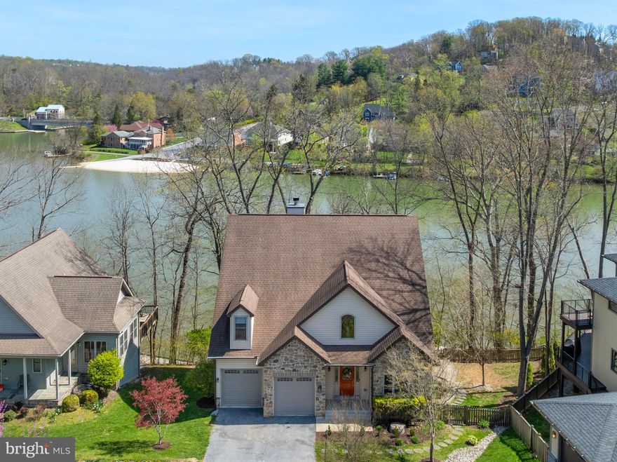 ***RARE & AMAZING OPPORTUNITY TO OWN YOUR VERY OWN DREAM HOME***EXTRAORDINARY LAKE FRONT BEAUTY***SPECTACULAR 5 BEDROOM/4 BATH WATERFRONT HOME WITH ALMOST 5000 SQUARE FEET ON 3 BEAUTIFULLY FINISHED LEVELS IN THE SOUGHT-AFTER COLDSTREAM COMMUNITY JUST STEPS FROM THE LARGEST BEACH IN LOVELY LAKE LINGANORE***BREATHTAKING WATER VIEWS FROM ALMOST EVERY ROOM***BUILD A PRIVATE DOCK & BRING YOUR PONTOON BOAT & START LIVING THE FABULOUS LAKE LIFE***This STUNNING home enjoys UPGRADES THROUGH OUT including SOARING CEILINGS, SOLID WOOD staircase & flooring on the top two levels, TWO CAR GARAGE, DOUBLE DECKS, a GOURMET KITCHEN, STONE WOOD BURNING FIREPLACE, MAIN LEVEL BEDROOM & Full BATH, ENORMOUS OWNERS SUITE with TRAY CEILING, COFFEE BAR & LUXURY BATH***FULLY FINISHED BASEMENT with IN-LAW SUITE with Kitchenette, Full bath & large Exercise Room***Cinch Home Warranty***CLOSE TO ALL AMENITIES***SWIM, BOAT, FISH, HIKE, ENJOY COMMUNITY SUMMER CONCERT SERIES, FARMERS MARKET, AND SO MUCH MORE***MUST SEE***