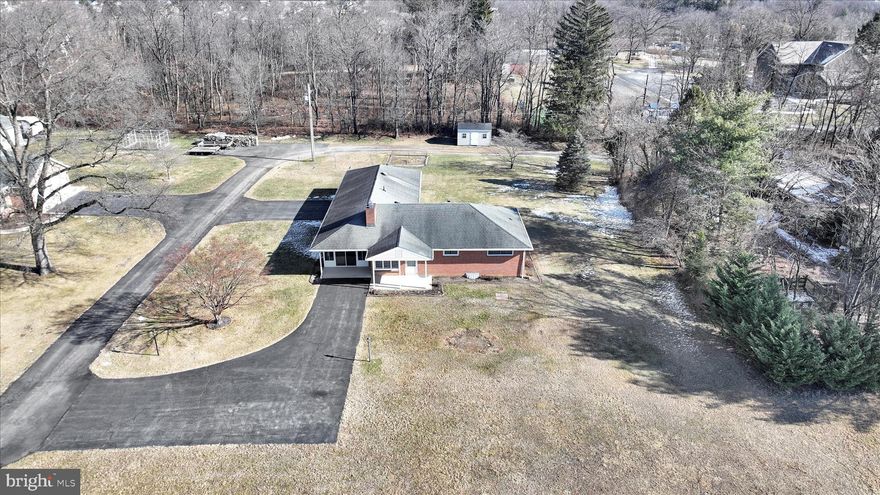 This solid brick ranch has a private and country-like feel yet is close to everything and is all within the Central Dauphin School District.  The home has access by private road and has 3 Bedrooms, 1.5 baths, Kitchen / Dining area, Living Room with Fireplace and insert (wood burning).  The partially finished Lower Level has a Family Room, Laundry / Utility Room, cedar closet and room for storage.  Enjoy the view on warmer days in the terrific large Sunroom or one of the covered porches, overlooking the front or rear yards.  Home has air conditioning, newer hot water heater, newer windows. The oversized 2 car garage has plenty of space for cars, equipment and toys.  Are you a gardener?  There's lots of room for that too.  Lot in front of home is also for sale (MLS PADA2056258), where you can bring own your plans and builder.  Public water, sewer and access are located off Patton Road.  Please see associated documents.