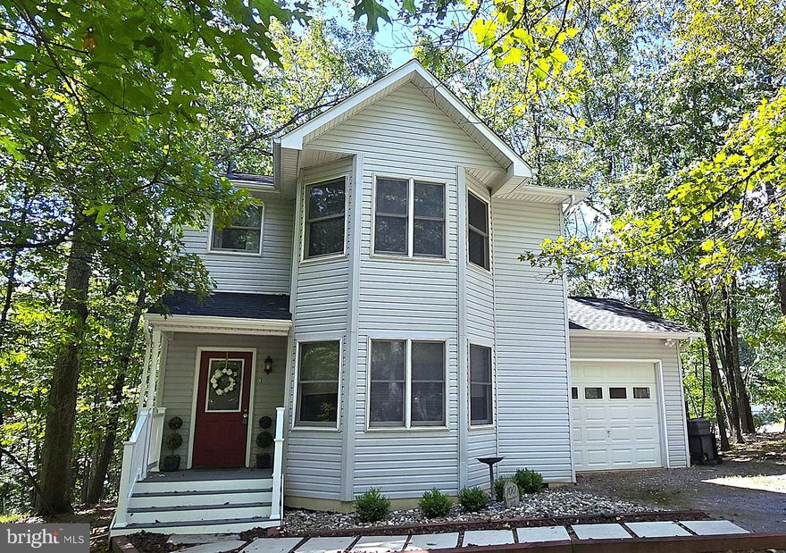 NEW PRICE! 10K PRICE DROP! FRESH PAINT & NEW FLOORING IN BEDROOMS! GATED LAKE COMMUNITY! BOATING! BEACH & ACTIVITIES! NEW ROOF 2023 | NEW APPLICANCES | NEW KITCHEN FLOORING |NEW DECK & DUAL HVAC | NEW FRONT PORCH WALKWAY! Beautiful 3 bedroom 2.5 bath home in gated lake community - Lake Holiday!  Enjoy bright happy light in this two story floorplan with gorgeous windows in both the primary suite and breakfast nook/dining area.  This unique floorplan will be sure to be one of your favorites as you explore Lake Holiday and all it has to offer!  INTERIOR: Sun-filled windows in dining room off kitchen.  Kitchen includes NEW stainless steel appliances, NEW flooring,  island with space for stools, door to garage for convenience carrying in groceries.  Galley style kitchen opens to both living room on one end and dining area on the other.  Living room has access to NEW rear deck - easy to step out and grill for dinner! On the upper level there are 3 bedrooms.  Primary suite has another set of windows to enjoy the gentle morning sun.  You will feel as if you are up in the trees as you begin each day! EXTERIOR:  NEW roof in 2023. Surrounded by mature trees and nature!  Spacious deck (17x7) off the living room is the perfect place to unwind at the end of the day.  Listen to the birds chirp and the squirrels scurry around! NEW front porch walkways is welcoming as you approach home each day! COMMUNITY: Lake Holiday has so many wonderful activities & amenities for residents.  Enjoy new pickleball courts, basketball courts, sand volleyball court, beach, boating, snack bar, community picnic area, dog park, frisbee golf course, walking/jogging trails, movies on the beach, fitness center, and more!  There is a marina with 100 boat slips available for rent. Sports fields available for baseball, softball and soccer.  The clubhouse is available for meetings, parties, and gatherings.  Do you enjoy fresh veggies in the summer?  Check out the community garden!  Visit the Lake Holiday website for more info.  Lake Holiday is not just a community it is a lifestyle!