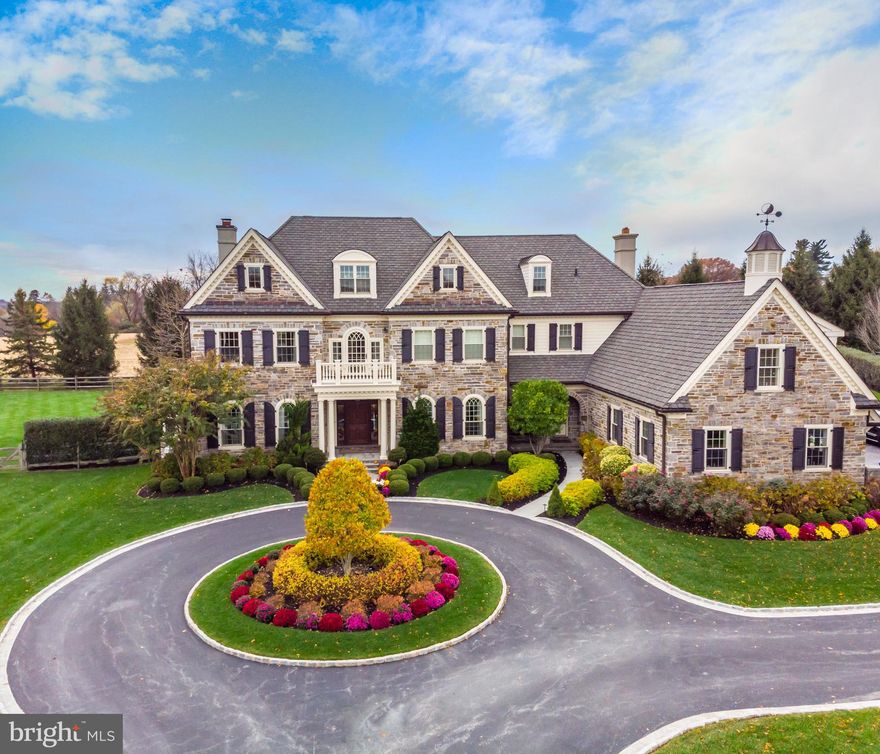 Be prepared to be WOWED- introducing 8 Withers Lane in the desirable community of White Horse and Top Rated Marple Newtown School District.  This 5 bedroom, 6.2 bathroom Stone Estate sits at the end of a cul-de-sac on a breathtaking 1.2 acre lot and exudes curb appeal from the second you drive up the circular driveway.  The interior offers dramatic 10ft ceilings throughout with a 12ft coffered ceiling in the family room.  Five inch oak floors grace the first floor while upgraded millwork and wainscoting greet you in every room.  The formal living room with bump out and professional office both offer gas fireplaces while the family room with separate play area has a cozy wood burning fireplace.  The focal point of the home is the incredible kitchen with massive marble island, custom inset cabinetry, commercial grade built-in appliances, and attached breakfast room with vaulted ceiling and french doors to yard.  The formal dining room is generous in size and has attached butler's pantry with inset cabinetry and wine fridge- this house is an entertainer's dream!  This level is completed with a tucked away "command center" perfect for another office or homework area, mudroom with built-in cubbies and stackable washer/dryer, and formal and informal powder rooms.  The second floor offers a magnificent master suite with sitting area, dramatic balcony, vaulted beamed ceiling, his and her closets with built-in shelving and a luxurious marble bathroom with radiant floor heating, soaking tub and oversized spa shower.  The four other bedrooms all offer ensuite bathrooms with walk-in closets and shelving systems and share a hall homework/hangout area with built-in desks.  The newer lower level is quite spectacular with professional quality movie theater, built-in entertainment center and bar area, billiards/game area, glass enclosed gym, and full bathroom.  The exterior of the home is not to be missed offering a huge, flat yard that is completely fenced with an open-air, covered porch, salt-water heated pool with automatic pool cover, and attached waterfall hot tub.  The house is very efficient offering Geothermal heating and air, energy efficient windows, and upgraded insulation throughout.  All of this while being steps to Episcopal Academy, a short few miles to some of the best private schools in the country, minutes to Downtown Wayne and Paoli Train Station and close to all major roadways fro an easy commute to Philadelphia, NYC, and Wilmington.  Call today for your private showing; this house is not to be missed!