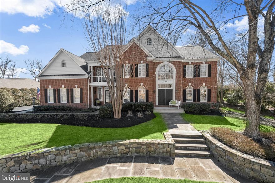 Welcome to Western Howard County, where this stunning Colonial in the Westwoods of Cherry Grove community combines impressive scale, thoughtful updates, and a private setting on 1.04 acres backing to trees. Offering over 8,000 square feet, the home has been meticulously maintained by its current owners and enhanced with numerous improvements throughout. Notable updates include a fully renovated primary bathroom with cathedral ceilings, renovations to additional bathrooms since 2019, and updates to moldings, trim, fixtures, appliances, and major utilities. The roof was replaced just one year ago, and recent upgrades also include kitchen appliances, the water heater, and the well pump.
Beautiful curb appeal sets the tone with mature landscaping, bluestone walkways, and a welcoming double-door entry. Inside, a soaring two-story foyer introduces the home’s open floor plan and refined details, including interior window shutters, charming built-ins, and elegant trim and moldings. A dedicated home office with custom built-ins and French doors provides a quiet place to work, while formal living and dining rooms feature crown molding and hardwood flooring that continues into the kitchen. Designed for both everyday living and entertaining, the kitchen offers a large island with seating, granite countertops, 42-inch cabinetry, stainless steel appliances, and a bright breakfast room. A spacious walk-in pantry with custom built-ins keeps everything organized, while just off the kitchen an additional office or homework station with desk space and storage adds convenience. The kitchen opens to a dramatic two-story great room filled with natural light from clerestory windows and anchored by a striking stone-surround fireplace. Practical spaces are thoughtfully incorporated as well. A spacious laundry room and a dedicated friends and family entrance create a functional command center for everyday coming and going, complete with ample storage for daily essentials.
Upstairs, the primary suite offers a luxurious retreat. The bedroom includes a private sitting room with a multi-sided fireplace, creating a warm and inviting atmosphere. The renovated en suite bath features a freestanding soaking tub, a beautifully tiled shower with frameless glass and dual shower heads, two vanities, and two water closets for added comfort and convenience. Cathedral ceilings enhance the sense of space, while two walk-in closets with custom built-in organizers provide generous storage. Three additional bedrooms complete the upper level, each with its own walk-in closet. Two share a connecting full bath, while the third enjoys a private en suite. A versatile loft area overlooking the main level currently serves as a home theater for movie viewing.
The unfinished lower level presents exceptional potential, featuring a brick-surround fireplace, a walk-up to the backyard, and abundant space for storage, recreation, or future finished living areas tailored to your needs.
Outdoor living is just as inviting. A beautiful bluestone patio with surrounding landscaping includes a built-in stone firepit and a connection box for a hot tub, creating a relaxing setting that overlooks the expansive, flat backyard and wooded backdrop. The property also features a 12.5 kilowatt generator system with an automatic switch for added reliability.
Conveniently located near schools, shopping, Larriland Farm, Cattail Creek Country Club, Western Regional Park, and major commuter routes, this exceptional home blends space, comfort, and thoughtful updates in the desirable Westwoods of Cherry Grove community in Western Howard County.