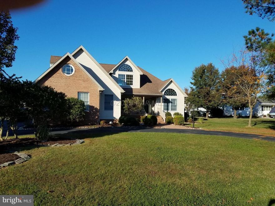 BEAUTIFUL  PARTIAL BRICK WATERFRONT 3 BEDROOM 2 1/2 BATH  2 STORY HOME ON A WIDE CANAL WITH A BOAT LIFT AND DOUBLE JET SKI LIFT. GREAT OPEN FLOOR PLAN WITH LOTS OF WINDOWS FOR A BRIGHT AIRY FEELING. FIRST FLOOR MASTER SUITE AND 2 BEDROOMS UPSTAIRS.  A LARGE GAME ROOM THAT CAN ACCOMODATE A POOL TABLE WITH AMPLE ROOM IS LOCATED ON THE 2ND FLOOR. THE GREAT ROOM HAS A CATHEDRAL CEILING AND A GAS FIREPLACE. THE 1ST FLOOR ALSO HAS THE KITCHEN, DINING AREA, DINING ROOM AND OFFICE. THERE IS A LARGE SCREENED PORCH AND A HUGE OPEN DECK OVERLOOKING THE LARGE REAR YARD AND CANAL. THE 2 CAR GARAGE IS OVERSIZED AND CAN ACCOMODATE 2 CARS AND A RIDING MOWER AND STILL HAVE EXTRA STORAGE. THERE IS AN OVERSIZED CULLIGAN WATER TREATMENT SYSTEM THAT CAN TREAT THE WATER AND THE IRRIGATION SYSTEM.