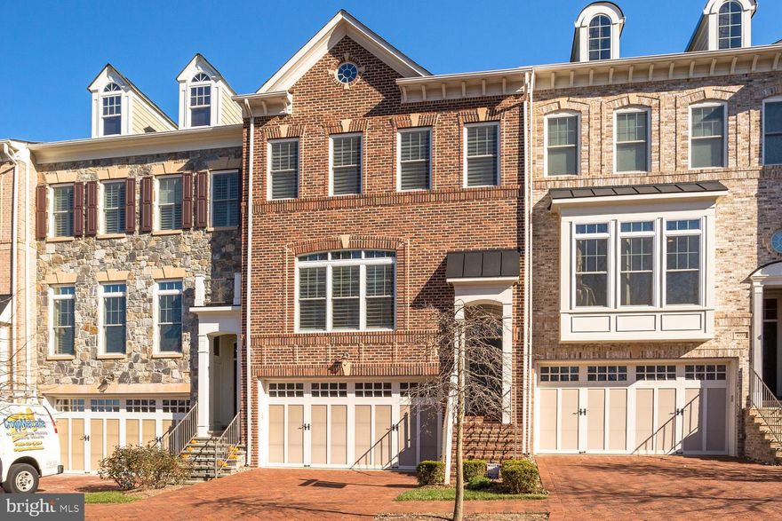 Spacious, bright, and well-maintained 4BR/3.5BA brick-front TH with a 2-car garage and open floor plan in secluded Stockwell Manor. Built in 2009 by Camberley Homes, this home boasts over $91k of builder options. The new owners put almost $40k into improvements in 2020. Gleaming hardwood floors on both the main and upper levels, including the upper level bedrooms as well as plantation shutters throughout. Main level features a gourmet kitchen with a large island, brand new Bosch refrigerator, new Wolf cooktop, new Asko dishwasher, and Kitchenaid wall oven, high-quality cabinets, and granite countertops. 10-ft ceilings and large windows allow for plenty of light and make the main level living areas feel warm and open. The upper level features 3 bedrooms and 2 bathrooms including a luxurious master bedroom with a box tray ceiling, a sitting area, and a large walk-in closet. The master bath includes separate vanities, a large bathtub, and a shower. The lower level has a rec. room, a full bathroom, and a bonus room that can be used as a 4th bedroom, nanny suite, or an office. The main level also walks out to a low-maintenance composite wood deck that leads down to a enclosed, beautifully hardscaped patio for entertaining and outdoor living. Common areas include a picnic pavilion, tot lot, and park benches. Prime location within walking distance to West Falls Church Metro, which provides easy access to Tysons, Reston, IAD, DCA, Arlington, and DC. A short drive to Whole Foods, Trader Joes, and the W. Broad St. shops and restaurants. Highly rated schools: Haycock ES, Longfellow MS, and McLean HS.