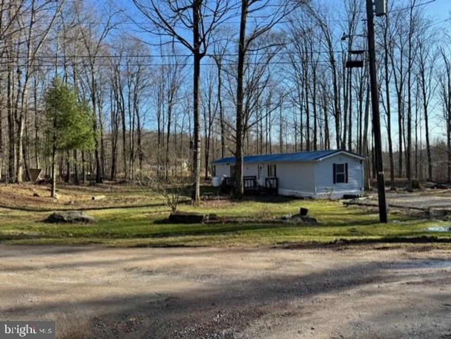 This well-kept 1990 mobile home sits on a leased private lot, boasting the tranquility of being the final property on a quiet dead-end road. Although peacefully secluded, it's conveniently located just 15 minutes away from the popular and scenic Lake Wallenpaupack. This affords a perfect balance of serene living with the benefit of close proximity to the lake's vast array of recreational opportunities. The mobile home offers a charming and comfortable living space for those seeking a getaway near nature without sacrificing convenience.  This is a 2 bedroom 1.5 mobile home located in a private setting, with a low ground rent of $306.00.  Well water and septic on property.  Own your own piece of paradise