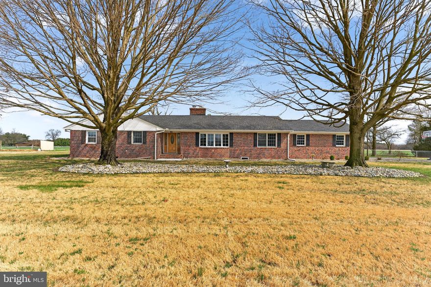 Enjoy the peace and privacy of country living with this spacious home situated on just over an acre, surrounded by farmland for a quiet and relaxing setting. The property offers plenty of outdoor space along with a partially fenced yard, perfect for your furry friends while still leaving ample room to enjoy the outdoors. Inside, the home features four bedrooms and three and a half bathrooms, with one of the bedrooms currently set up as a home gym, giving you flexibility to suit your lifestyle. The main level offers two comfortable living spaces along with a large dining area just off the kitchen, creating an ideal layout for both everyday living and entertaining. The fully finished basement is a true standout, designed with the feel of your own private pub. This unique space includes a pool table, a large entertainment area, and a dedicated office, making it perfect for hosting friends, relaxing, or working from home. Additional features include a two-car garage and a 3-zone heating and cooling system, allowing for greater comfort and efficiency throughout the home. With its spacious layout, entertainment-ready basement, and peaceful setting surrounded by farmland, this property offers the perfect blend of privacy, functionality, and room to enjoy both inside and out.