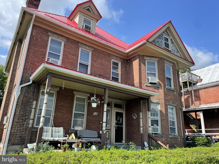 Space for all!!!!  Six spacious bedrooms, two full baths, high ceilings, tons of closets and a fenced in flat yard.  The walk-up attic has an adorable bedroom plus tons of extra space for storage, a hobby room, an office or more!  Beautiful red metal roof looks so classic with the brick exterior.  Laundry hook ups are available on the second floor and the basement.  Convenient access to I68.  This HOME just might be the one you are searching for!