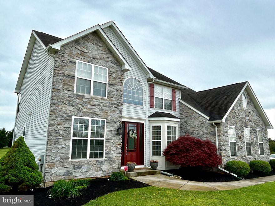 Welcome to this stunning colonial home which exudes elegance and charm. Nestled on 3 acres of picturesque countryside in lovely rural subdivision minutes from Charles Town with easy access to Route7 and Route 340 for commuters.  You can even have horses here!  Home boasts over 4,000 square feet of luxurious living space. Step into the grand foyer adorned with a large arched window and stylish lighting fixture, setting the tone for the wow factor that awaits.

The main level boasts tall ceilings that seamlessly blend the partially open and traditional floor plan beautifully.  The main level family room with handsome fireplace with pellet stove insert and a modern-rustic  stone  surround flows to the gourmet/chef's kitchen with breakfast area.  You will not run out of space in the kitchen with the abundance of cabinetry and counter space and large quartzite kitchen island.  The kitchen leads to an expansive deck with a step-down conversation area, providing breathtaking views of the scenic vista. There's a nicely sized dining room, a parlor and quaint and quiet office space, along with a full bath on the main level.  Every room has a view! The gleaming wide-planked, hand-distressed hardwood floors on the main level are hard to ignore.  Every element of this home was constructed with quality materials and are on full display.

Upstairs, retreat to the primary bedroom featuring a sitting area, a luxurious primary bath with a jetted tub and a step-in shower with a glass enclosure. Three additional bedrooms and another full bath with a tub/shower combination complete the upper level.

The lower level is an entertainer's dream, featuring a spacious gaming area, an equipped wet bar, and several sitting areas.  A full bath and large workout room offer convenience and versatility.  This 4 bedroom home could be easily converted to 6 bedrooms as some rooms feature closets. The lower level effortlessly extends your entertaining to the outdoors by walking through sliding glass doors to paver patio addition with a fire pit and is the perfect place to star gaze. 

This remarkable home offers the perfect blend of sophistication and comfort, providing ample space for both relaxation and entertainment.  You will be visually amazed by the beautifully untouched countryside in this area of the county as there are many farms and beautiful meadows to adore. Don't miss the opportunity to make this exquisite property your own!