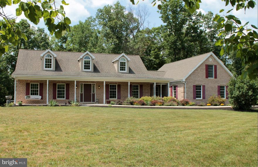 Brick cape cod on 28.58 wooded acres with 1-acre stocked pond. Finished living space above garage could be separate apt or in-law suite. Custom kit w/tile flrs, granite counters, cherry cabinets, & stainless steel appl. Great room w/cathedral ceilings, flooded with sunlight & views, with direct access to the 23x30 ft rear deck. Main Flr Master. Bsmt w/12ft ceilings. Includes Tax ID#2205008611