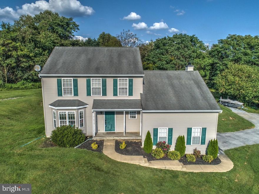 Enjoy the gorgeous views of the rolling hills of Chester County, from this well-maintained home! Situated on a private 1.6 acre lot...this property is located close to major routes, shopping and schools. The first floor offers a formal living room/office with a cozy window seat, overlooking panoramic views through a beautiful bay window, a formal dining room, a sunny, eat-in kitchen with newer LG stainless steel appliances, an island and eat-in area, which opens to a family room, featuring a Mendota gas fireplace (installed in 2016) and sliding glass doors that step out onto an oversized concrete patio that was built to accomodate an addition. The first floor is completed by a powder room and a laundry room that leads to an attached 2 car garage. The second floor features a spacious master bedroom with master bath and walk-in closet, as well as 2 additional bedrooms and a full bathroom. The full basement is finished and offers a media area with built-ins for TV and gaming equipment and is wired for surround sound. All bedrooms and living room offer lighted ceiling fans. This property has LOW TAXES and southern sun exposure on the front of the house. Central air was installed in 2013, with a warranty good thru 7/2023. Electric water heater was installed in April 2020. This property features a radon system and a descaler and UV filter for the well water. There is a stoned parking pad, which offers additional boat/trailer parking.