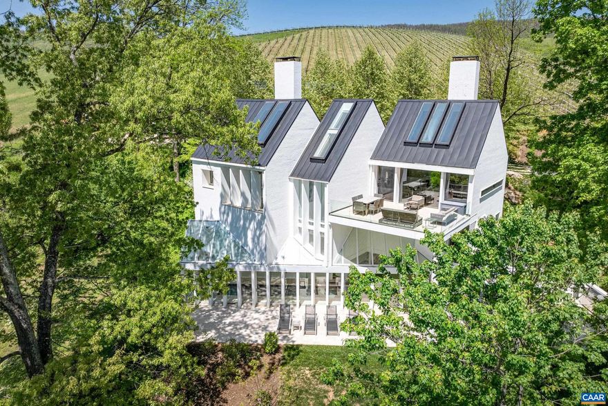 OPEN SUN JUNE 8 FROM 12 to 2  In the heart of award-winning Veritas Vineyards in coveted Afton wine country, Saddleback Sanctuary is sure to impress. A stunning contemporary designed by renowned architect, Hugh Newell Jacobsen, it stands as a sentinel of the Rockfish Valley. Light pours in through three stories of glass showing off astounding mountain, valley & vineyard views. Step in to main living level with open plan connecting great room, dining & kitchen, all appointed with upscale features and finishes. Great room w/ fireplace & soaring cathedral ceiling opens through glass doors to an upper patio with room for dining & relaxing while taking in the views. Even the stairwell is a work of art, leading down to the mid-level which has a home office w/ fireplace, guest quarters and luxury Owner?s Suite w/ fireplace and lavish bath. Find a surprise on the terrace level with an indoor, heated lap pool, a guest bedroom w/ ensuite bath and access to fabulous patio & outdoor kitchen. The home is an entertainer's delight! Owners made meticulous improvements, converting the property to a successful vacation-rental w/ excellent revenue forecasts: see link! Turnkey, conveys furnished. Close to popular Nelson151 amenities!,Solid Surface Counter,White Cabinets,Fireplace in Great Room,Fireplace in Home Office,Fireplace in Master Bedroom