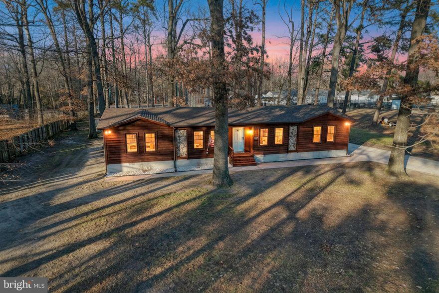 MOTIVATED SELLERS.... INSPECTIONS ARE COMPLETED & SELLERS ARE OFFERING $10,000 TOWARDS BUYERS CLOSING COSTS!!! Welcome home to this lovely country gem! This 3 bedroom, 2 bath ranch home approximately 1700 sq ft, sits on over a half-acre nestled among mature trees. The home was completely remodeled in 2016, including new septic, roof, new windows and heat pump. Freshly painted, inside and out! Central A/C was updated in 2022. As you enter the home, you'll notice the LVP flooring running throughout the main living area. The spacious open floor plan is perfect for entertaining and day-to-day living. The kitchen boasts plenty of counterspace, large kitchen island, pantry and stainless-steel appliances. The primary bedroom offers a roomy private bath, double basin vanity, pedestal sink and bathtub with surround. On the opposite side of the home, you'll find 2 more nicely sized bedrooms and a full hall bath. Just off of the kitchen and laundry room area you'll find an exterior door leading to a 12x15 deck. Enjoy your morning coffee or afternoon beverages as you lookout over the spacious backyard with 22x52 above ground pool (new in June 2025) and an 8x8 shed. Another plus, no HOA or deed restrictions! This property offers comfort and quiet country living.  Inspections are completed all you need to do is move in! Schedule your showing today, you'll be happy you did!!