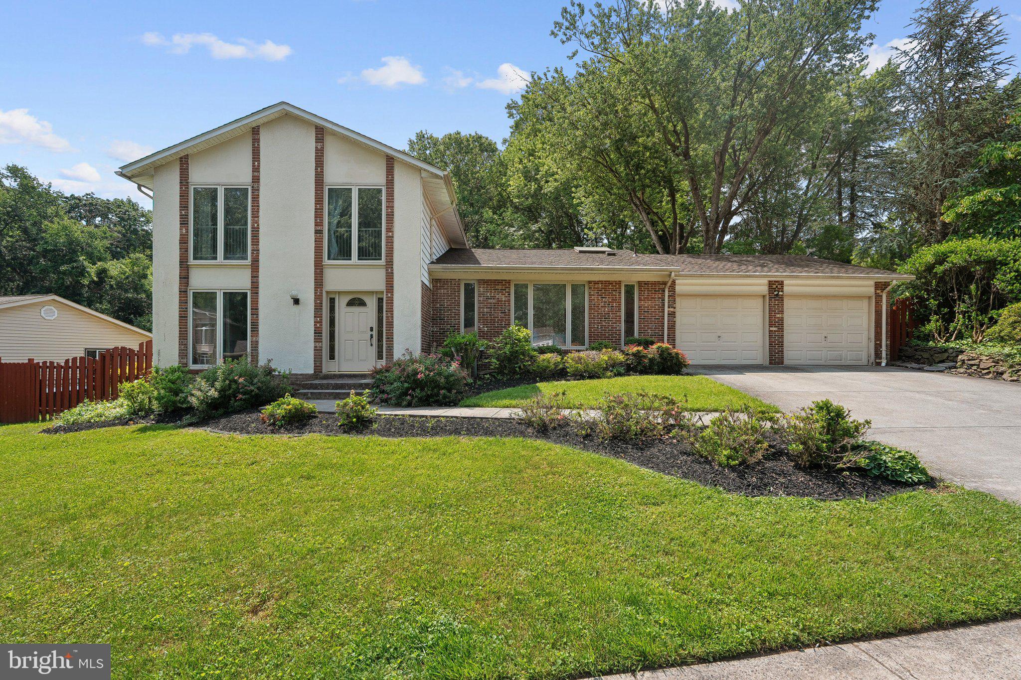 This stunning split-level home in the charming Town of Vienna offers 5 spacious bedrooms and 3 full bathrooms and a layout that is ideal for both relaxation and entertaining. Enjoy the warmth of hardwood floors and the comfort of carpeted areas, complemented by recessed lighting and skylights that enhance the inviting atmosphere. The gourmet kitchen features stainless steel appliances, upgraded countertops, and ample table space, making it a chef's delight. A cozy fireplace in the living area adds charm, while the fully finished basement provides additional living space. Step outside to a beautifully landscaped 0.44-acre lot, complete with a personal pool, hot tub, and multiple outdoor entertaining areas including decks and patios. The property backs to serene trees, offering privacy and a tranquil view. With an attached 2-car garage and convenient main-floor laundry, this home combines luxury with practicality.