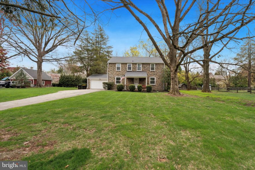 Welcome to this well-maintained colonial home, nestled in the heart of Blue Bell and located within the highly regarded Wissahickon School District. This charming single-detached property sits on a beautifully manicured 0.64-acre lot. Step onto the inviting front porch and enter a classic colonial layout, where the central staircase elegantly separates the living room from the dining room. The dining room exudes warmth and charm, featuring multiple windows that allow natural light to fill the cozy space. The living room is equally inviting, complete with a wood-burning fireplace—perfect for relaxing evenings. The main level is fully carpeted and leads into a spacious, tiled kitchen. The kitchen boasts a breakfast area, ample counter space, and abundant cabinetry. Adjacent to the kitchen is a convenient powder room and an exit to the backyard. At the rear of the home, you’ll find a bright and airy solarium surrounded by windows, offering an abundance of natural sunlight and serene views of the beautifully landscaped backyard. Upstairs, the home offers four bedrooms. Bedroom one, located to the left, features a closet and two windows. Bedroom two was previously used as an office but can easily be converted into a bedroom; it also includes two windows and a closet. A dropdown attic ladder is centrally located in the hallway, providing access to a spacious attic with ample storage. Bedroom three is generously sized, while the master bedroom offers two closets for plenty of storage and includes an en-suite bathroom with a stand-alone shower. The full basement offers exciting potential and awaits your finishing touches. One side features a former bar area with ample space for entertaining, while the other side can be transformed into a comfortable relaxation or media area. The washer and dryer are brand new as of 2024. Additionally, the heating boiler was just serviced in 2024. The oversized two-car garage offers ample room for both parking and storage. Conveniently located just minutes from shopping centers, major highways, and within the Wissahickon School District, this home is full of potential and charm—ready for its next owners. Schedule your showing today—this Blue Bell gem won’t last long!