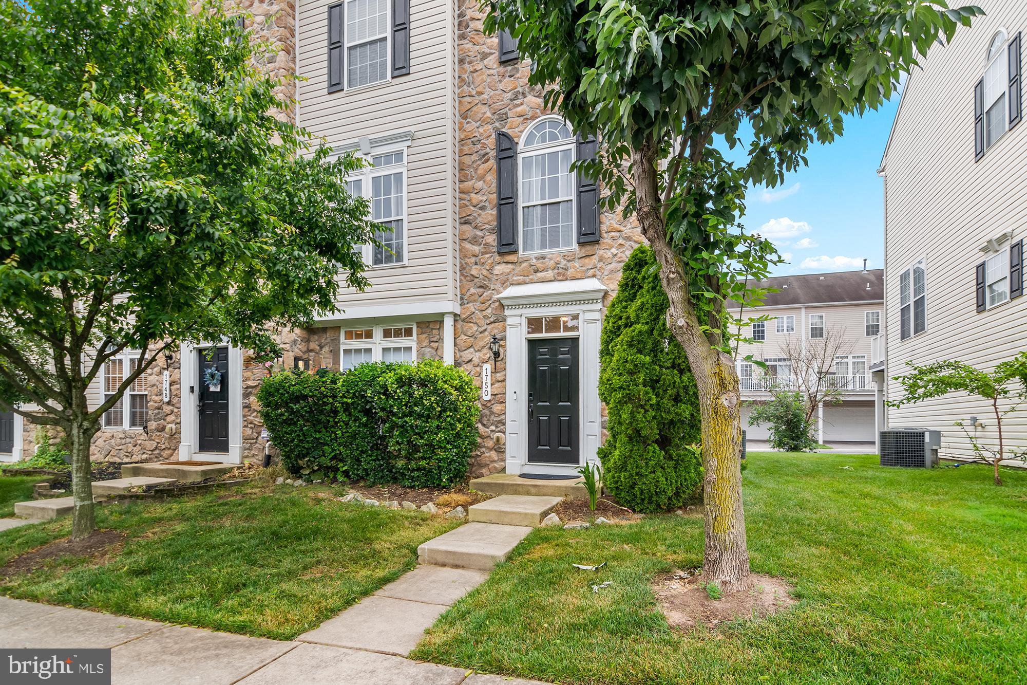 Welcome to 1750 Theale Way – a beautifully updated townhome in the desirable Villages of Dorchester community in Hanover! This gorgeous home offers modern finishes, functional spaces, and a layout perfect for comfortable living and entertaining. The entry-level features a versatile open space ideal for a second living room, home gym, or office, plus a dedicated laundry room and access to the spacious 2-car garage. You'll love the brand-new LVP flooring on this level and the updated stairs leading to the main floor. Upstairs, the main level impresses with a chef’s kitchen featuring a gas cooktop, double wall ovens, and stainless steel appliances. The spacious dining area flows seamlessly onto the deck—perfect for gatherings or enjoying your morning coffee. The large living room and a stylish half bath complete this welcoming floor. The upper level includes three bedrooms, highlighted by a luxurious primary suite with a spa-like bath featuring a soaking tub, walk-in shower, dual vanities, and a generous walk-in closet. Two additional bedrooms share a full hall bathroom. Updates throughout the home include new ceiling fans, upgraded light fixtures, fresh paint, and new flooring on the lower level and stairs. Community amenities include a pool, playground, and clubhouse, with easy access to DC, Baltimore, and Annapolis. Don’t miss this move-in ready gem—schedule your showing today!