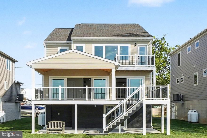 Waterfront home seekers now have a rare opportunity to own a superbly constructed 2" x 6" home offering 3,768 square feet of updated living and storage space. Recently renovated inside and out, this property features LP Smart siding and soffits, along with new windows and doors on every level, all enhanced with designer like finishes. Outside, enjoy a brand-new wooden bulkhead and an impressive 100-foot pier extending over the water—perfect for entertaining, relaxing, or simply taking in the peaceful sounds and sweeping views that stretch all the way to the Baltimore City skyline. This home offers two primary bedrooms, each with its own full bathroom—one conveniently located on the main level and the other on the upper level—ideal for guests or multi-generational living. Enjoy unobstructed, Key West-style sunset views that are nothing short of spectacular.  Located in the ever-popular 21219—known as “The Land of Pleasant Living” and “Where Life Imitates Vacation”—this home has been thoughtfully redesigned to embrace year-round waterfront living. Every day brings a new experience, from vibrant sunrises and radiant sunsets to wildlife, waterfowl, and glowing moonlit reflections across the water. Each season offers its own charm, from colorful springs and warm summers to serene winters and crisp autumns. Inside, the home features a pristine open floor plan with wood-look flooring throughout, abundant natural light, and a bright white kitchen complete with ample cabinetry, drawers, and many pull-out shelving units. The spacious great room showcases stunning 16'ft and 8'ft sliding doors that open to a 30' x 12' waterfront deck with a maintenance-free vinyl railing system—perfect for indoor-outdoor living.  Why deal with the challenges of new construction when this turnkey home is ready to enjoy? Waterfront inventory along the Baltimore County shoreline remains limited, especially for homes of this caliber. This property is ideal for year-round living or as a second home retreat. Enjoy crabbing, fishing, paddleboarding, kayaking, swimming, and boating right from your backyard, complete with a new 10,000 lb electric boat lift and dedicated PWC watercraft storage.  Conveniently located just minutes from North Point State Park and Sparrows Point SE Regional Park and Community Center, and only a short paddle to Pleasure Island and Hart-Miller Island, this home is a dream for outdoor and water enthusiasts. The Millers Island community offers a vibrant lifestyle with year-round events, including golf cart parades, tree lightings, chili and bake-off contests, 5K runs, holiday celebrations, pickleball, and more.  With easy access to I-695, I-95, Baltimore City, and BWI Airport, this location offers both tranquility and convenience. Skip the beach traffic and enjoy the waterfront lifestyle right here in Baltimore County. Whether you are downsizing, upsizing, or seeking the perfect getaway, this home offers an unmatched blend of comfort, lifestyle, and location. Live simply, beautifully, and create lasting memories in your own waterfront retreat.