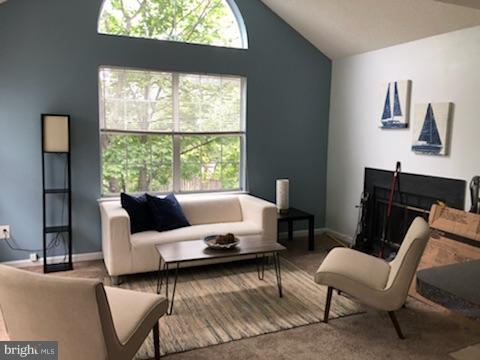 Beautifully Remodeled 2 Bedroom open floor plan condo includes vaulted ceilings, wood burning fireplace and bright, light filled rooms. All new stainless steel appliances, corian counter tops w/ complimenting cherry cabinetry. This Second Story unit offers off street parking, mature landscaping walking distance to Laurel Lakes Town Center & Restaurants. Rarely available and wont last...
