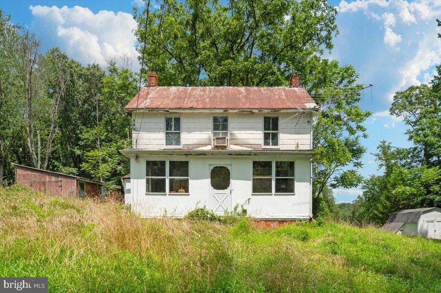 Beautiful views and surroundings await!  Bring your horses for unlimited riding potential. Appreciate the convenience of hunting from one of the three elevated cabin stands - one with electric.  Wade in the waters of Little Bennett Creek. Plenty of room for livestock, crop farming, or other outdoor activities. The existing house is a major rehab with well and septic in place.  Owner or agent to accompany all showings. The owner or agent will answer other questions about the site and house. There is a hidden gem at back portion of the property serving as the farm office or  beautiful chalet for your weekend retreat.