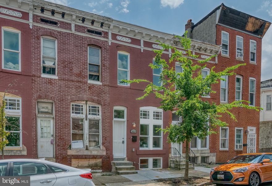 Completely rehabilitated in 2021, Greek Revival historic row home in Baltimore’s Oliver neighborhood. This 3-bedroom, 3-bath home features a modern layout and a fully finished lower level that has been thoughtfully improved to provide comfortable, reliably dry additional living space—an uncommon advantage in many Baltimore row homes. CHAP tax credit eligibility for another 6 years offers valuable property tax savings. Located about 1.2 miles from Johns Hopkins Medical Campus and 1.5 miles from Baltimore Penn Station, you’re near community farms, parks, schools, and coffee shops. Stroll Score, Transit Score, and Bike Score in the low- to mid-70s add everyday convenience. Perfect for investors as a solo purchase, or suitable to bundle with other rentals. Eligible for the Live Near Your Work homebuyer.