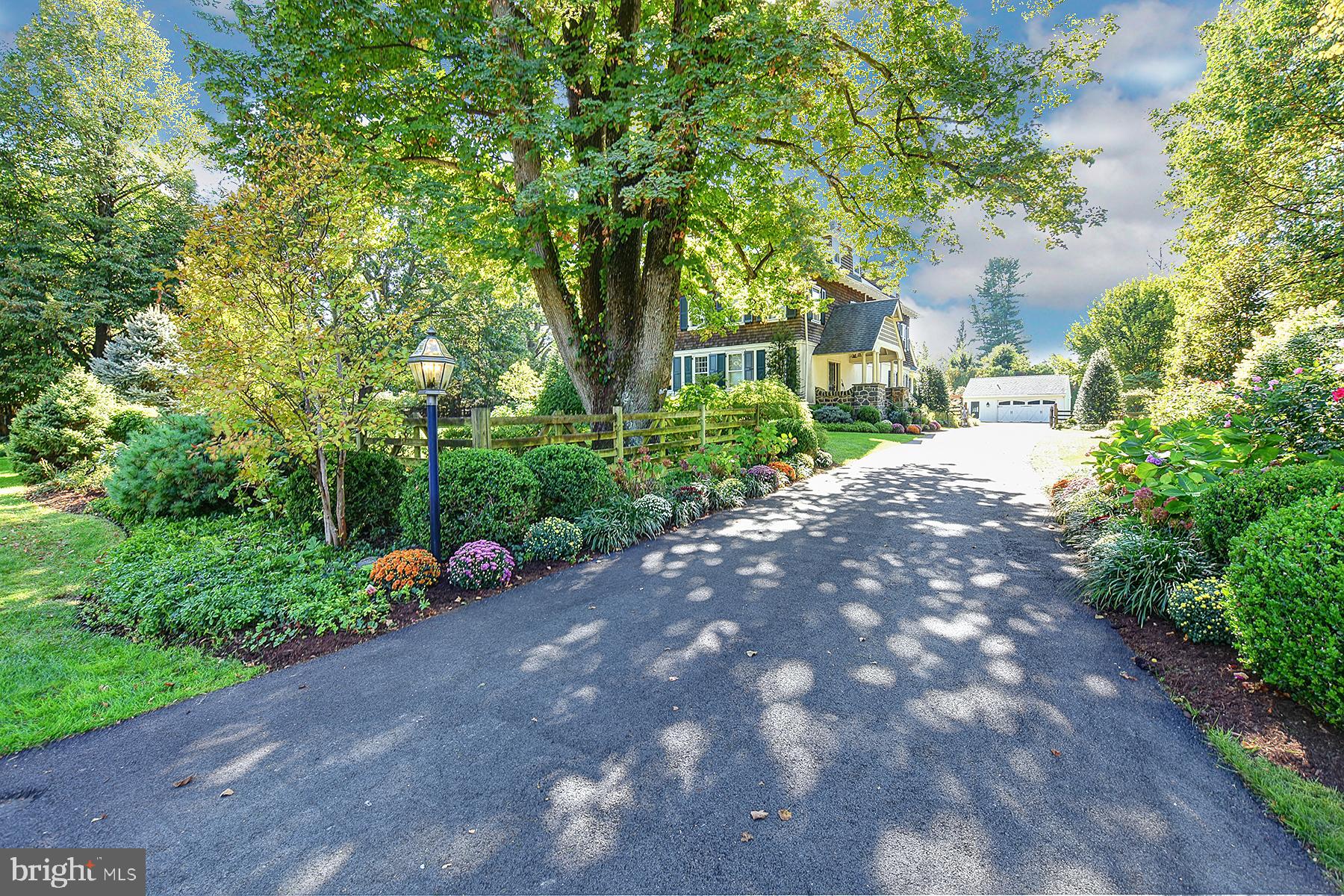 "The 512" on the mailbox identifies one of the most admired of South Devon's extraordinary older homes. Situated on a level, gorgeously landscaped 1-acre lot, this gracious Georgian-style home built in 1842 certainly has a long history but its most recent is the story of a home filled with love, laughter, children and lots of family and friends. Neighbors walking or driving by over the past 30+ years of the Seller's ownership marveled at the transformation from a rather nondescript 3-story old house to its present-day grandeur including a dramatic stone, side-facing covered porch entry, cedar siding and authentic architectural moldings and windows. The renovating began in earnest with 2003's reconfiguration of the entire back of the house. Designed for our modern open lifestyle, the new "hub" of this beautiful home includes a lovely CUSTOM KITCHEN with all the requisite updates: island w/seating and pendant lighting, granite counters, tile backsplash and flooring, wood cabinets, stainless double sinks, Wolf double wall ovens and warming drawer, 5-burner Dacor gas cooktop, Sub Zero refrigerator and back stairs to the 2nd floor. Adjoining the kitchen is a terrific BUTLER'S PANTRY and separate BREAKFAST AREA which leads into the warm, inviting FAMILY ROOM addition featuring a stylish, lighted Dome and coffered ceiling, custom built-in cabinet/bookcases, raised-hearth FIREPLACE and radiant-heated brick floor. The large wall of windows in both the Family Room and Breakfast Area allow for lots of natural light easily muted by the motorized window shades and exterior awnings. The more formal LIVING ROOM with built-ins and DINING ROOM with stunning crystal chandelier each also has crown molding, HW inlay floors partially covered with carpet and double French doors opening to the large private FLAGSTONE TERRACE w/covered awning and step-down to a fenced side yard. The entire first floor flows easily from one room to another making for entertaining nirvana. The second floor holds the spacious MBR w/new carpet, motorized window shades and adjoining MASTER BATH with double corian counter sinks; three generously-sized BR's and full bath; two additional BR's, a former BR converted into a large closet and full bath complete the third floor. Saving the best for last is the incredible backyard oasis filled with beautiful lighted trees, bushes and perennials offering seasonal delight as well as privacy surrounding the heated IN-GROUND POOL AND SPA! A separate POOL HOUSE/FULL BATH for easy swimsuit changing and a lovely FLAGSTONE PATIO with pergola and a motorized canopy offers a peaceful, serene warm-weather refuge at your doorstep. Add'l features include: 1st Floor with 9' ceilings; and 2nd Floor with 8'6" ceilings; backyard fencing w/two gates; driveway has add'l parking on side yard and has motorized gate; irrigation system for front and back yards; whole house generator; 2-car detached garage; Sonos stereo system for interior and pool area; newer septic system, basement French drain/sump pump and oil boiler; plantation shutters on many windows. Sought-after location in well-regarded T/E schools, within walking distance to the train, Radnor Trail, schools, and shopping and restaurants at Devon Yard and Wayne - Welcome home!