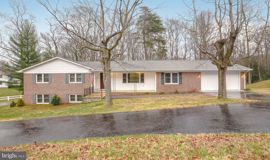 Beautifully maintained all brick rambler on huge corner lot with mature trees and very private back yard.  This home is located in the sought-out neighborhood of Esperanza Farms with water access to the Patuxent River.  Come enjoy the views from the fully enclosed four-season sunroom.  This house has a large walk-out basement featuring a second full size kitchen, complete with standard size appliances, as well as a second laundry room.  Lots of space to entertain- inside and out, especially with the additional generous covered patio, and a cozy fireplace.  1 bedroom and 1 large bathroom with walk-in shower is located in the ground level, fully finished basement, making this a perfect mother-in-law suite.  Oversized two car garage, with horseshoe driveway as well as an additional expansive driveway alongside of the house, offering plenty of off-street parking for you and your guests.  Hurry-this well priced gem won't last long!!!!