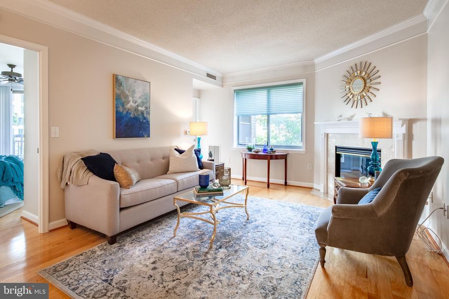 ** Sought after 2 bedroom Virginia Square condo - steps from Metro and Starbucks! ** Open floorplan with gleaming wood floors throughout, gas fireplace, spacious balcony, and a split bedroom design for maximum privacy.  Laundry in unit. ** Great building amenities - outdoor pool, game room, fitness center, party room, and excellent on-site management.  ** Fantastic walkability with VA Square Metro directly across the street! ** 2 garage parking spaces and storage unit included in rent. **  Available August 1st. **