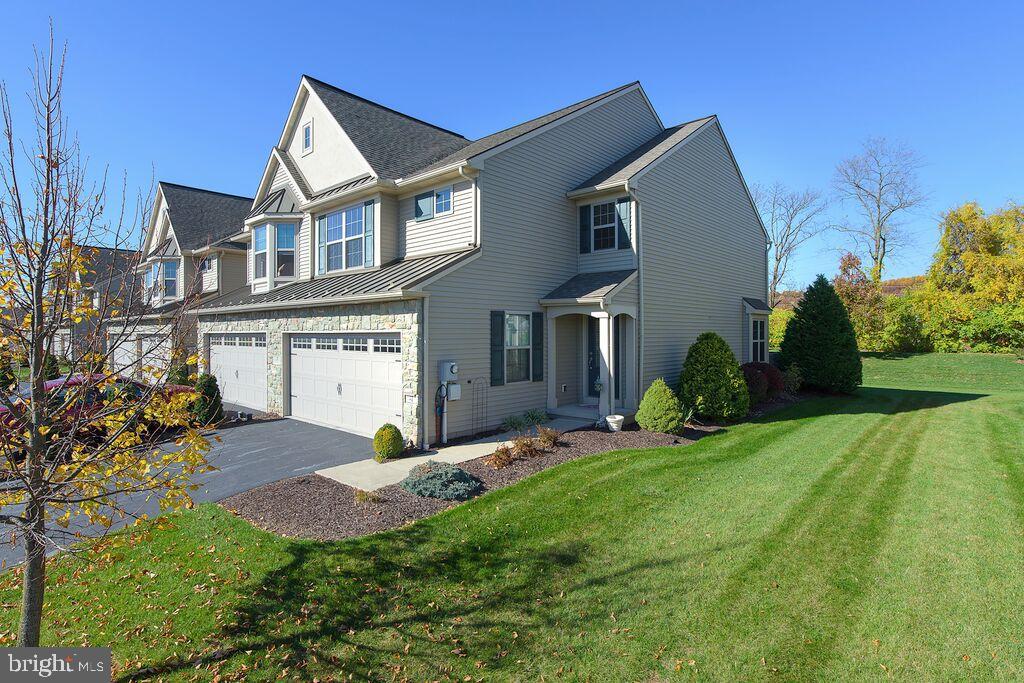 Immaculate 7-year-old End Unit in Brookview Estates w/ h/w floors, crown molding, upgraded lighting, gas heat, gas fp w/ mantle, open concept kitchen w/ upgraded cabinetry, recessed lighting, & brkfst bar, a sunny dining area w/ sliders leading to deck/paver patio combo. Upstairs has a two story stairway, upstairs laundry, & big master suite w/ walk-in closet & master bath w/ stall shower & soaking tub. Plus a 2-car garage & low HOA fees.