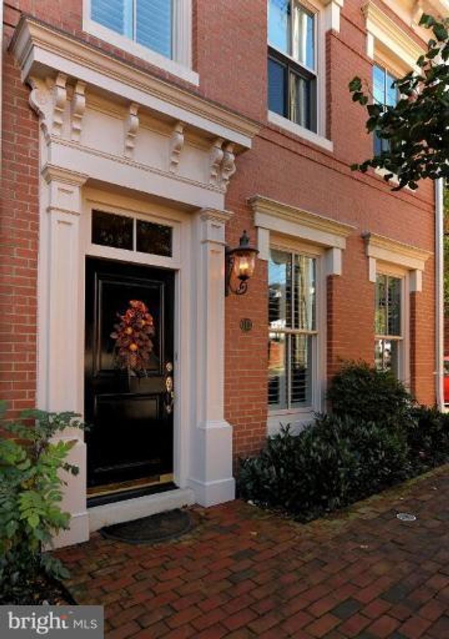 Stunning end townhouse in Backyard Boats with gracious room, high ceilings, detailed moldings, hardwood floors, plantation shutters and drapery, interior elevator and attached 2 car garage.  3 spacious en-suite BR, 4/5 Ba with custom vanities, stainless-granite kitchen open to family room, wood paneled library with handsome built-ins, extensive closets, exercise room and beautiful private patio.