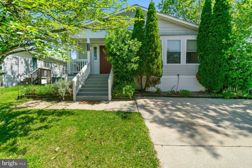 ***BACK ON THE MARKET!! BUYER FINANCING FELL THROUGH*** Welcome to 6445 Woodland Forest Drive, located on the beautifully manicured streets of Meadowridge Landing. Step beyond the raised flower beds filled with reseeding wildflowers and the brick red door to find that this 2 bedroom, 2 full bathroom home is much larger than it initially appears. Greeted by a living room large enough for a media room and reading nook, the numerous windows illuminate the space making it feel even larger. The dining room, also flooded with natural light, is outfitted with a built-in cabinet perfect for displaying your favorite china or collectables. As you pass through the kitchen large enough for an island, the bathroom skylight draws your eye down the hall to two spacious bedrooms. The primary is complete with an ensuite bathroom and walk in closet. The second bedroom you'll find is large enough to become a shared bedroom or guest space plus office. In addition to being freshly painted and carpeted, this home features new HVAC installed in 2023, new hot water heater in 2023, gutter guards in 2024, new fridge in 2024, new dishwasher in 2021, and new washer in 2022. As you exit to the back, the side porch is the perfect size for a buffet table where you can enjoy your morning coffee amongst your plants. The backyard, equipped with a Tuff-Shed, built in 2018, backs the HOA maintained greenspace, which creates the perfect oasis. Conveniently located to Route 100, I-95, BWI, and the MARC commuter rail, depart from one of your two off-street parking spaces for a hassle free adventure. If you're not looking to travel far, you can also find yourself within minutes of several parks, including Patapsco State Park, Meadowbrook Athletic Complex, and Troy Hill Athletic Fields, and the shops and dining in Elkridge, Columbia, and Ellicott City.