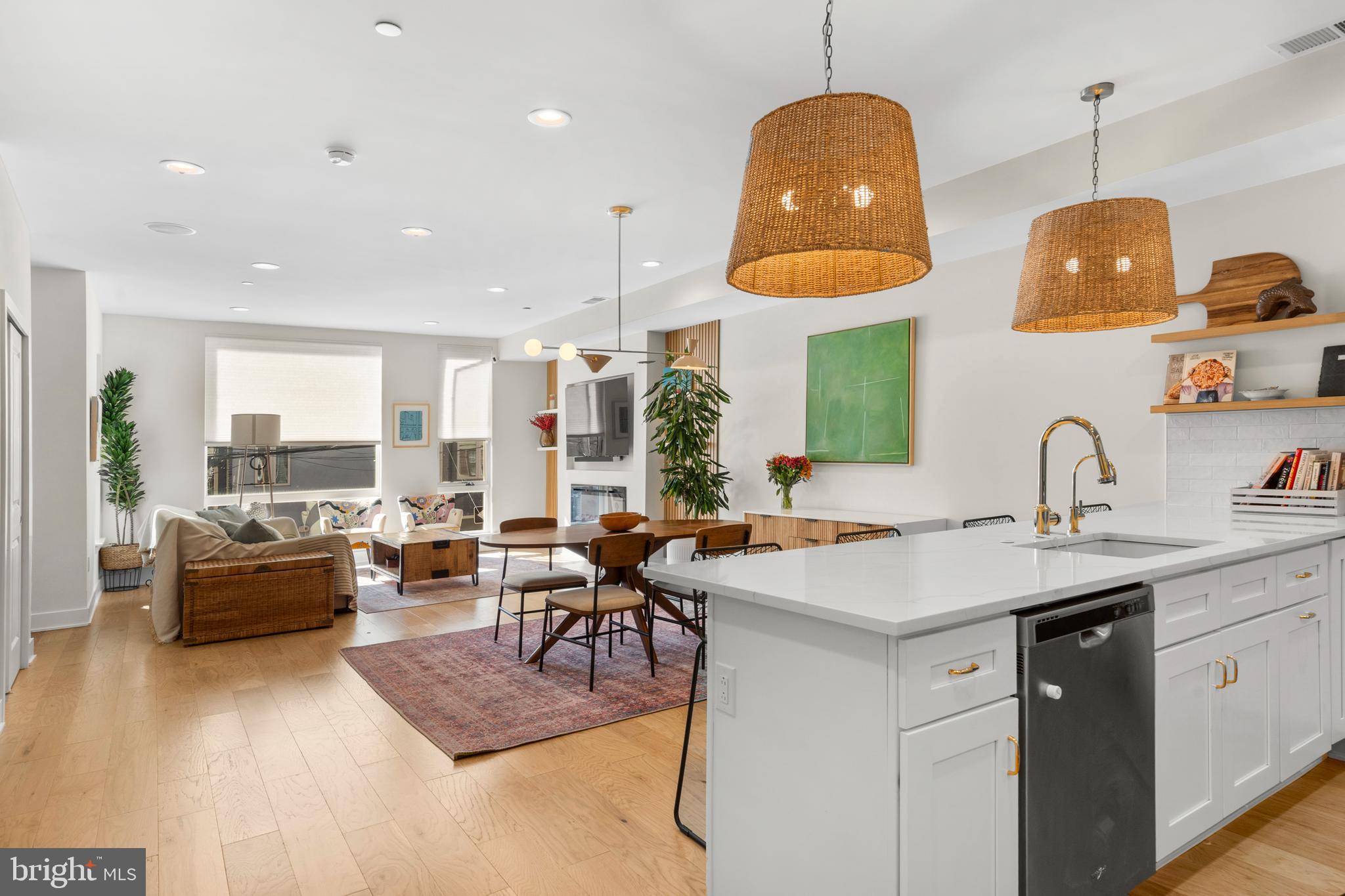 Welcome to 439 E Wildey Street, a unique 2,873 square-foot carriage home tucked away on a quiet, tree-lined street in the heart of Fishtown, Philadelphia’s most vibrant and evolving neighborhood. Just a short trolley ride to Fairmount and the Philadelphia Zoo, and within walking distance to Penn Treaty Park, the Battery, playgrounds, top-notch coffee shops, vintage boutiques, and the ever-popular Frankford Avenue corridor, this home offers the perfect balance of neighborhood charm and urban convenience. With exciting new developments on the horizon, including a brand-new Sprouts grocery store opening on Delaware Avenue in 2025, this location continues to grow in both appeal and value.
Unlike the typical narrow row houses of Philadelphia, this spacious two-story residence offers a wider and deeper footprint, giving you more living space on each floor and reducing the need for constant stair climbing. Enjoy the convenience of a PRIVATE, GATED PARKING lot complete with an electric car charger, as well as a sizable under-home storage unit featuring electrical outlets and multiple access points — perfect for seamless organization and added functionality. Framed by mature trees, the backlot is especially picturesque in the spring and summer, bringing a peaceful touch of nature to your daily routine.
Inside, thoughtful upgrades enhance everyday comfort and convenience. A whole-home water filtration system delivers clean, filtered water to every faucet, shower, and appliance. On the second floor, a well-appointed wet bar featuring a sink, under-counter fridge, and water line serves as an ideal space for entertaining or crafting your dream coffee nook. Electric fireplaces in both the den and the primary suite add cozy ambiance and supplemental heat, while electric shades on every window and blackout curtains in each second-floor bedroom provide privacy with the touch of a button. The primary suite is a true retreat, complete with a custom-built closet, dedicated vanity area, and a fog-free illuminated mirror for a luxurious finishing touch.
Cap it all off with a full-length rooftop deck boasting panoramic views of the Philadelphia skyline and nearby Delaware river. Whether you’re entertaining, relaxing, or just enjoying the seasons, 439 E Wildey Street offers a rare and refined lifestyle in one of the city’s most dynamic neighborhoods. Property is only 3 years old. Please verify with the City how many years are left on abatement, but this is a full TAX ABATEMENT, not the step down tax abatement.