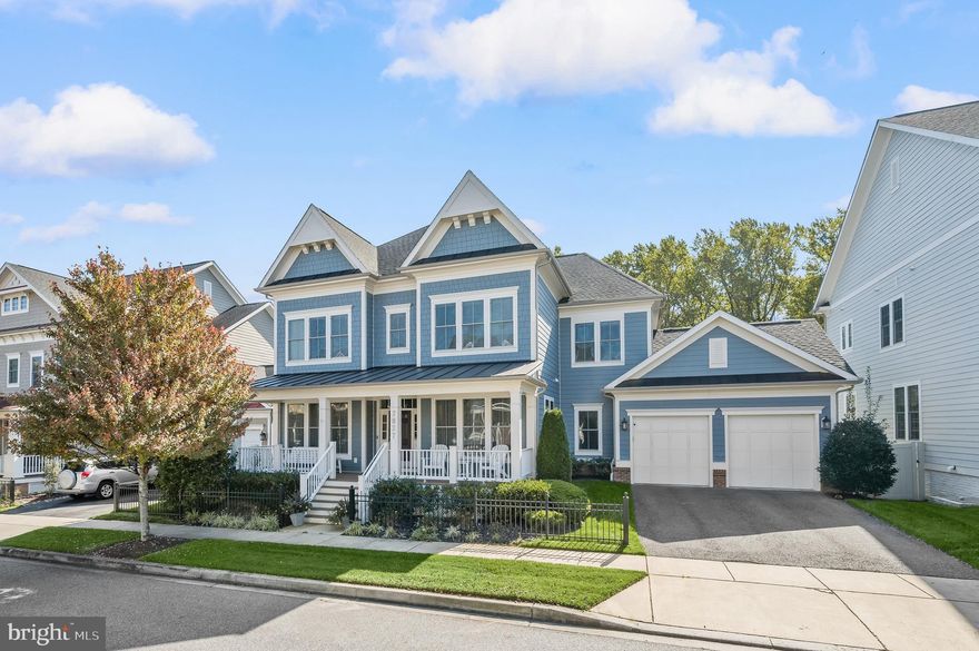 Listed and Under Contract Simultaneously.  This stunning Emerson floorplan by Michael Harris Homes is located in Midtown-West on one of the most sought after streets in the community on a private lot backing to conservation area.  The home features hardwood flooring throughout the main level, upgraded kitchen appliances, a custom bar in the lower level, extensive hardscaping, and more.