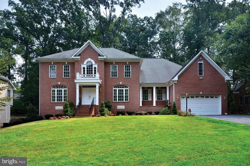 Stunning 2002 colonial w/amazing floorplan, sun-filled rooms & high ceilings!   The entire home has been completely painted inside and out, and new carpet installed.  The main level encompasses  a 2-story Foyer entry, formal Living Room, formal Dining Room, a huge Family Room w/gas fireplace, a main level Library (or could be 5th Bedroom), a full bath, gourmet Kitchen w/island, Breakfast Room (w/French doors to the backyard terrace/backyard), 2 pantry closets, a separate Laundry Room and another small room plumbed for a future Half Bath.  Upstairs has 3 large bedrooms with ensuite full baths and a knockout Primary Bedroom Suite with a 3-sided gas fireplace, a separate sitting room, multiple oversized walk-in closets, and a Primary Bath with separate tub and shower, plus multiple vanities/sinks.  The almost 2,400 sq ft basement is ready to be finished and features lots of windows and French doors to stairs that lead up to the backyard.  2-car garage and a long driveway that can accommodate many cars.   This spectacular price reflects its location and the home’s very quiet interior.  Don't miss out on this fantastic, exquisite home!!