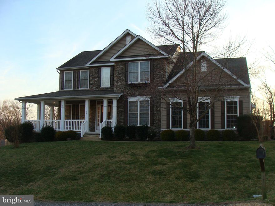 Welcome home! This one has it all. 4 BD, two full baths, one of which is located off the master BDR. Beautiful hardwood floors everywhere! Huge kitchen with island, and off the kitchen is the family room with gas fireplace. Formal living room, formal dining room, and office all on the main level plus laundry room and washer & dryer included.   Basement is fully unfinished with a walk-out to access the large 6 ft privacy fenced yard that backs to woods and has a wooden playground set. The upper level has the four bedrooms with some rooms freshly painted. Don't forget the cozy covered porch that wraps to the side.