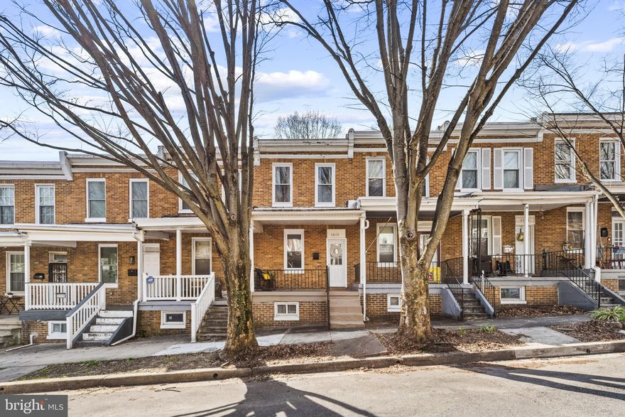 Welcome to 3610 Malden Avenue — a beautifully renovated 2-bedroom, 1-bath townhome nestled in Woodberry, one of North Baltimore’s most charming and convenient neighborhoods. Located on a quiet, tree-lined street with ample parking, this classic all-brick home blends timeless character with thoughtful modern updates.

Start your day — or unwind in the evening — on the quintessential Baltimore covered front porch spanning the full width of the home. Inside, newly installed luxury vinyl plank flooring flows through the bright living room and into the spacious eat-in kitchen, designed for both comfort and functionality.

The recently renovated kitchen features rich cherry wood cabinetry, sleek white quartz countertops, and a large island with seating — perfect for casual dining or entertaining (2025), Modern appliances, including a dishwasher, make everyday living effortless.

Upstairs, brand-new wall-to-wall carpeting adds warmth to two generously sized bedrooms, each offering ample closet space. The updated full bath showcases stylish tilework, new fixtures, and a vanity with additional storage (2025).

The finished lower level with new wall to wall carpeting provides flexible living space ideal for a family room, home office, or home gym, along with a separate laundry and utility area for added convenience. A full-size side-by-side washer and dryer (2025), electric-water heater (2023), Central Heating/Airconditioning ensures year-round efficiency and comfort. Energy-efficient double-pane windows have been installed throughout.

Just off the kitchen, a private veranda offers a peaceful outdoor retreat with views of nearby Woodberry Park, while a petite fenced yard provides opportunities for gardening, entertaining, or simply enjoying the outdoors.

Enjoy easy access to outdoor recreation at nearby parks, local cafes, boutiques, restaurants, and craft breweries — all part of Woodberry’s vibrant community charm. Commuting is a breeze with the nearby Light Rail stop, offering quick access to downtown Baltimore, Hunt Valley, and major highways including I-83.

This move-in-ready gem combines location, charm, and modern convenience — don’t miss your opportunity to call 3610 Malden Avenue home