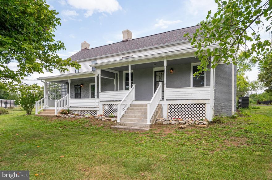 This lovely farmhouse on 0.58 acres has been completed redone! It features updates and upgrades throughout. It includes, new plumbing, new wiring, new HVAC, new heat pump, and a brand-new roof! This house comes with no worries! A couple of stairs walk-up to the large, double porch. This gives you plenty of space to enjoy those country views. Inside you have a large mudroom with LVP floors. This would be a great space for a small sitting room or hall tree to keep the family organized. The large kitchen features the same LVP floors and Mahoghany cabinets.  Counters are granite and accented by the lovely backsplash. All appliances are new and classic, stainless steel. The space features a back staircase and is topped off by a wood burning fireplace. A couple of stairs walk you up to the large dining room. Here we have redone hardwood floors and a ceiling fan. Beyond that is your spacious living room with refinished hardwood floors.  Here you have access to the front porch and your main staircase. The laundry room features tile floors, hook ups and linen closet. Tile carries into the luxury full bath. Here you have plenty of storage between the double bowl vanity and linen closet. The 5 ft tub/shower combo features tile surround. Upstairs you have two generously sized bedrooms with carpet. The back staircase provides a private entrance to the primary bedroom. It features redone hardwood floors, ceiling fan and a large closet for storage. Outside of the home you have a patio and concrete pad. Beyond that is a large gravel driveway for ample parking.  There are two storage sheds that convey. The cellar has been cleaned up and houses the new hot water tank. There are hookups for an ADU accessory building in the rear of the home. Your lot is lush with grass and mature trees all around the property. Perfect for the dogs to run and enjoy. This home has so much to offer - call before it's gone!