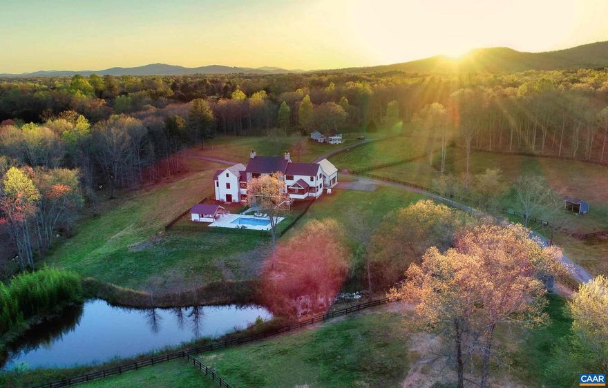 Comprised of three parcels in the heart of Keswick Estate Country, this stunning modern farmhouse offers a seamless blend of modern design and warm character on 35 acres. The welcoming great room features 10' ceilings adorned with wooden beams and custom barn doors to frame the pastoral view. Notable features of the residence include 1st floor primary with his/her baths, a Miele kitchen, geothermal and a 42K generator. The social center is the terrace level built with soaring 11? ceilings for a golf simulator, a custom bourbon bar, and terraced home theater.  Enjoy a resort-style rear lawn with a heated saltwater pool and covered cabana with an outdoor kitchen & full bath. Unwind by the fire pit or enjoy the game in the shade with outdoor media and a Sonos sound system. Equestrian offerings include a 6-stall barn with attached 3 BR residence, four paddocks with three 2-stall run-ins, a 150? x 255? riding ring, and a 2 BR caretaker?s apt above the 48?x30 workshop. Lastly, there is a charming 2 BR renovated cottage well suited for guests preferring one-level living. Not under easement. Fiber internet. Convenient to Cville & Richmond, this estate enjoys privacy and serenity while just mins from Keswick Club amenities & UVA.,Glass Front Cabinets,Quartz Counter,White Cabinets,Wood Cabinets,Fireplace in Great Room,Fireplace in Kitchen