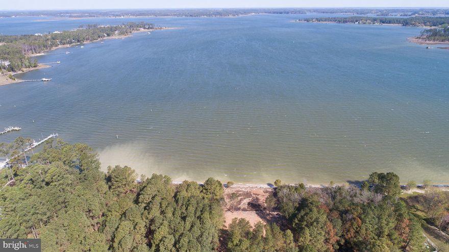 Nestled at McKeil Pointe, this stunning wooded waterfront lot boasts one of the prime locations in Dorchester County. Featuring 530 feet of shoreline along Fishing Creek, a tributary of the Little Choptank River, this exceptional property offers an ideal setting for your dream home. The lot includes an elevated building pad and road base installed in 1999, with a new sewer connection available. Situated at the end of a cul-de-sac, the property ensures minimal traffic and a high degree of privacy. Enjoy the numerous attractions of the Eastern Shore, including great values, boating, water sports, crabbing, fishing, biking, and natural beauty. The site is conveniently located near the Chesapeake Bay, Blackwater National Wildlife Refuge, Harriet Tubman Visitors Center, and the renowned Eagleman and Ironman Triathlon bike route.