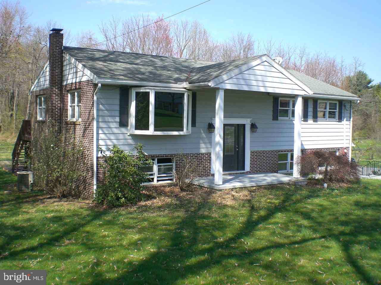 Ready to move in is this over sized bilevel w/ wood floors on the main level, a new kitchen w/ slow close drawers & appliances & a brand new oil boiler. 3 bedrooms & a bath on the main level w/ a large deck off the dining area overlooking woods. The lower level features 3 finished rooms & a full bath w/ ground level access. The sand pad is already down for your above ground pool to be installed & this location is acceptable for USDA financing (100%).