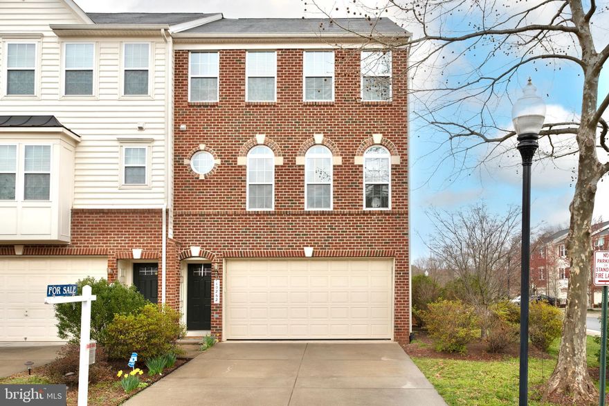 A gorgeous, brick front, end unit located in the Historic District of Manassas City! The largest home in Wellington Village features 3 bedrooms / 3.5 bathrooms. This three level townhome has EXTENDED BUMP OUTS on all levels and offers over 3,248 sq. ft of living space. The Master bedroom features UPGRADED "His & Hers" walk-in closets and an EXTENDED SITTING AREA. The upper level includes TWO additional Large Bedrooms with a Full Bathroom in the hallway. LARGE Gourmet kitchen, with gas range, granite countertops, stainless steel appliances, and much more. Fenced back yard with stamped & sealed concrete patio, EXTENDED TREX deck with lighting. Enjoy parking your vehicles in the 2 car garage with INSULATED garage doors, PLUS a 2 space driveway. Additional upgrades include NEST thermostats, and NEST doorbell, an irrigation system by Hydrotech. Convenient location, walk to grocery store and restaurants, minutes to Manassas VRE, and a dog park in the neighborhood are among the many amenities.