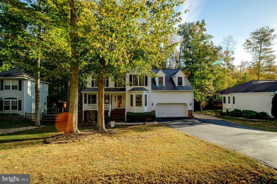 Nestled among the trees on a quiet cul-de-sac in a peaceful community featuring 3 finished levels, front porch, 2 car garage, large level lot, deck, family room with stone surround fireplace, mud room off garage, large master suite with walk-in closet and updated full bath with sep tub & shower, double vanities, finished basement with office, 5th br (NTC), full bath with jetted tub, much more.