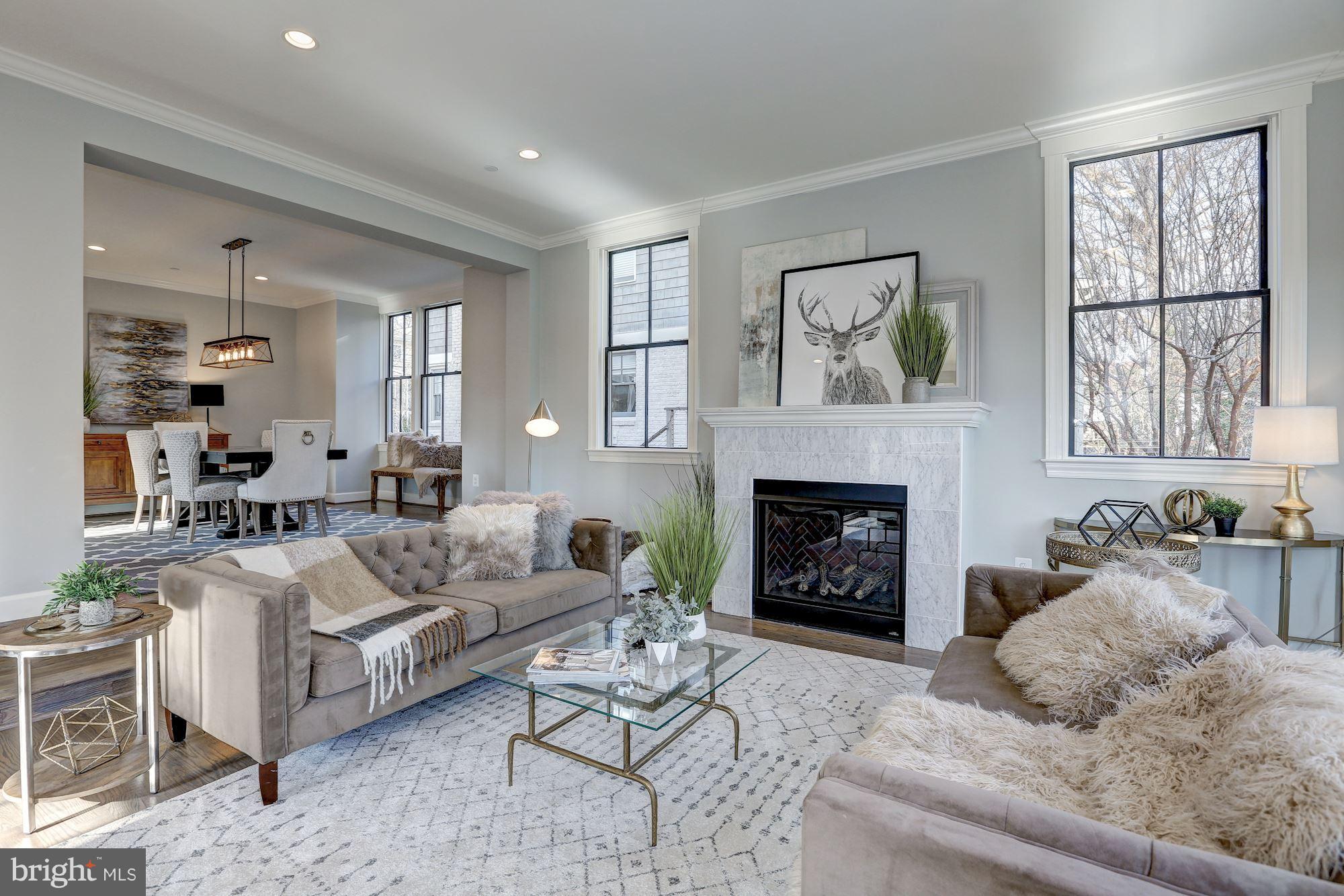 SOMETHING NEW & Special, enjoy brushed gold finishes, double french doors to a vintage brick patio, soaring ceilings, double DW & 2 option laundry room. Spacious bedrooms, 3rd floor guest suite w/ living area & fully walk-out basement. Tree line view off living areas. BCC Cluster schools. Blocks downtown Bethesda Metro, shopping, restaurants, parks & so much more!