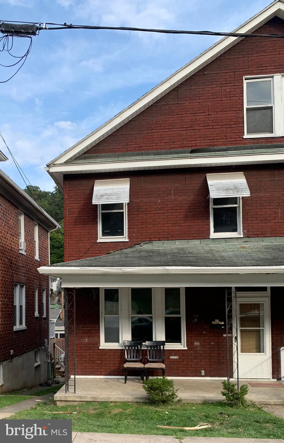 HUGE 1/2 Duplex offering 4 levels*Main flr offers foyer, hallway, liv rm, din rm, kit w/ refrigerator, dishwasher & walk in pantry*2nd flr offers 3 br's, hallway & full ba*Top flr is a lrg walk up attic*Walk out basement w/ 1/2 ba*Fen. backyard, front porch, two rear porches and detached half of a garage features 1 car parking*Lincoln a small street between Bedford & Frederick Streets*Sold as is. Some shingles missing on roof and roof leaks has caused some interior damage. Home needs cleaning and wall, ceiling some flooring repairs and pain in addition to the needed roof repair.