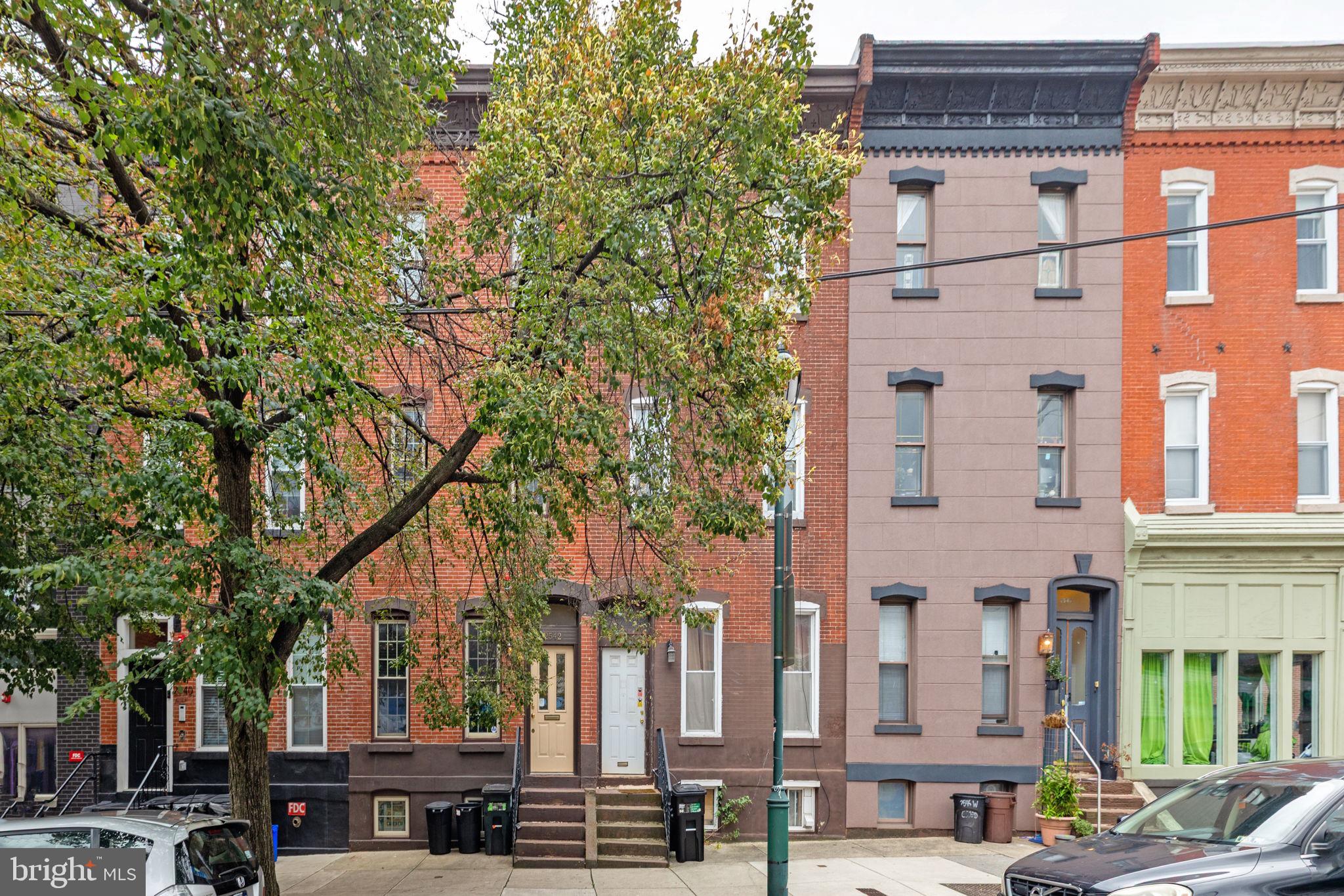 Experience the best of city living in this stunning first-floor apartment located in a classic brownstone at 2542 W Girard Avenue, nestled in the heart of sought-after Brewerytown. This beautifully appointed 2-bedroom, 1-bathroom unit perfectly blends historic charm with modern finishes — featuring soaring ceilings, oversized windows, and original architectural details that bathe the space in natural light.
The spacious, open-concept living area is ideal for both relaxing and entertaining, while the updated kitchen provides plentiful cabinetry and countertop space for easy meal prep. Two well-sized bedrooms offer excellent closet space, and a refreshed full bathroom completes the home.
Step outside to your private rear patio, offering a serene spot for morning coffee, grilling, or evening unwinding — a rare outdoor bonus in the city.
Located just steps from Brewerytown’s vibrant restaurants, cafés, bars, Fairmount Park, and public transportation, this first-floor gem delivers timeless brownstone elegance with the convenience of modern urban living.